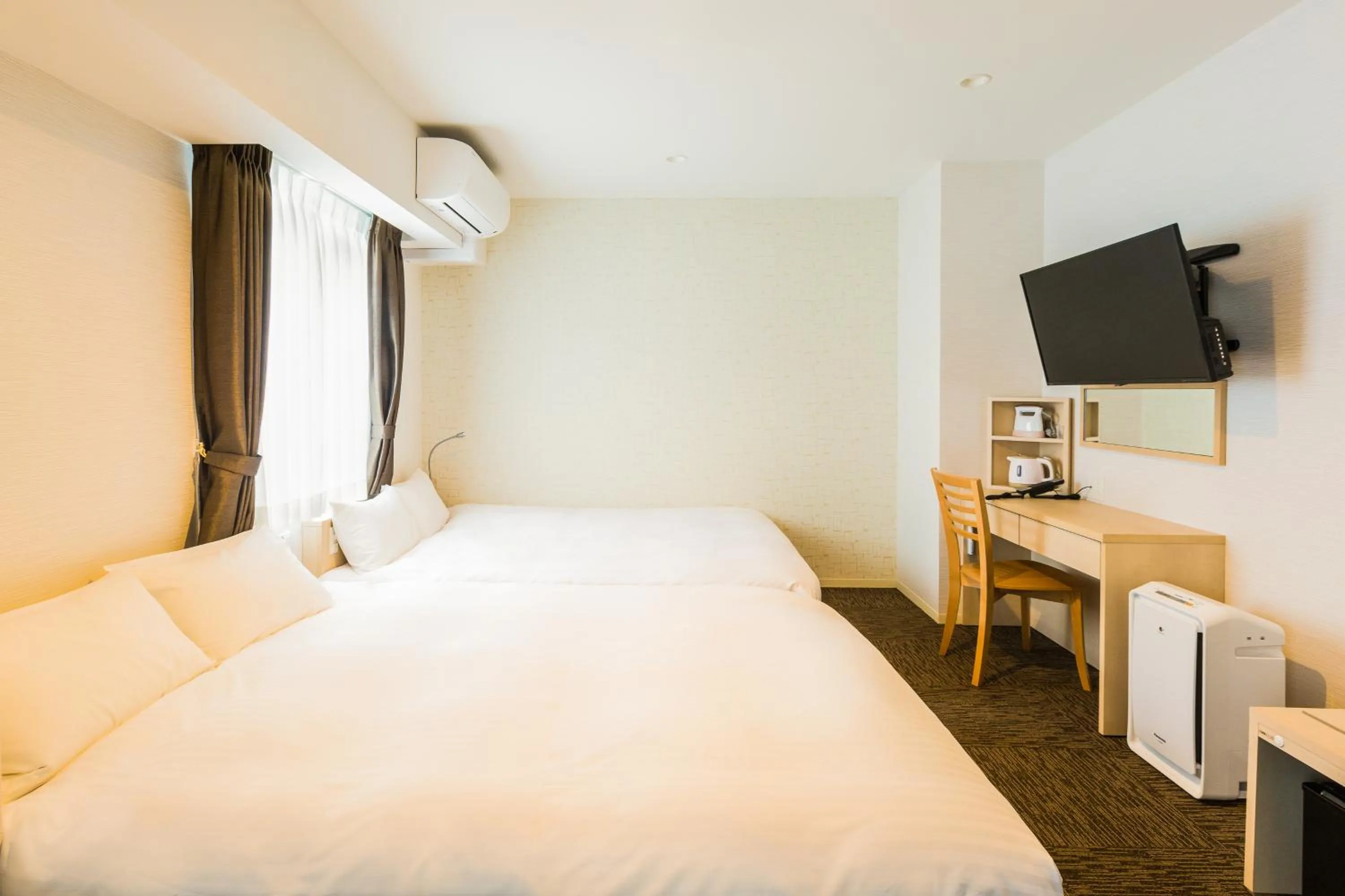 Photo of the whole room, Bed in EIWA PLACE HOTEL Hakata