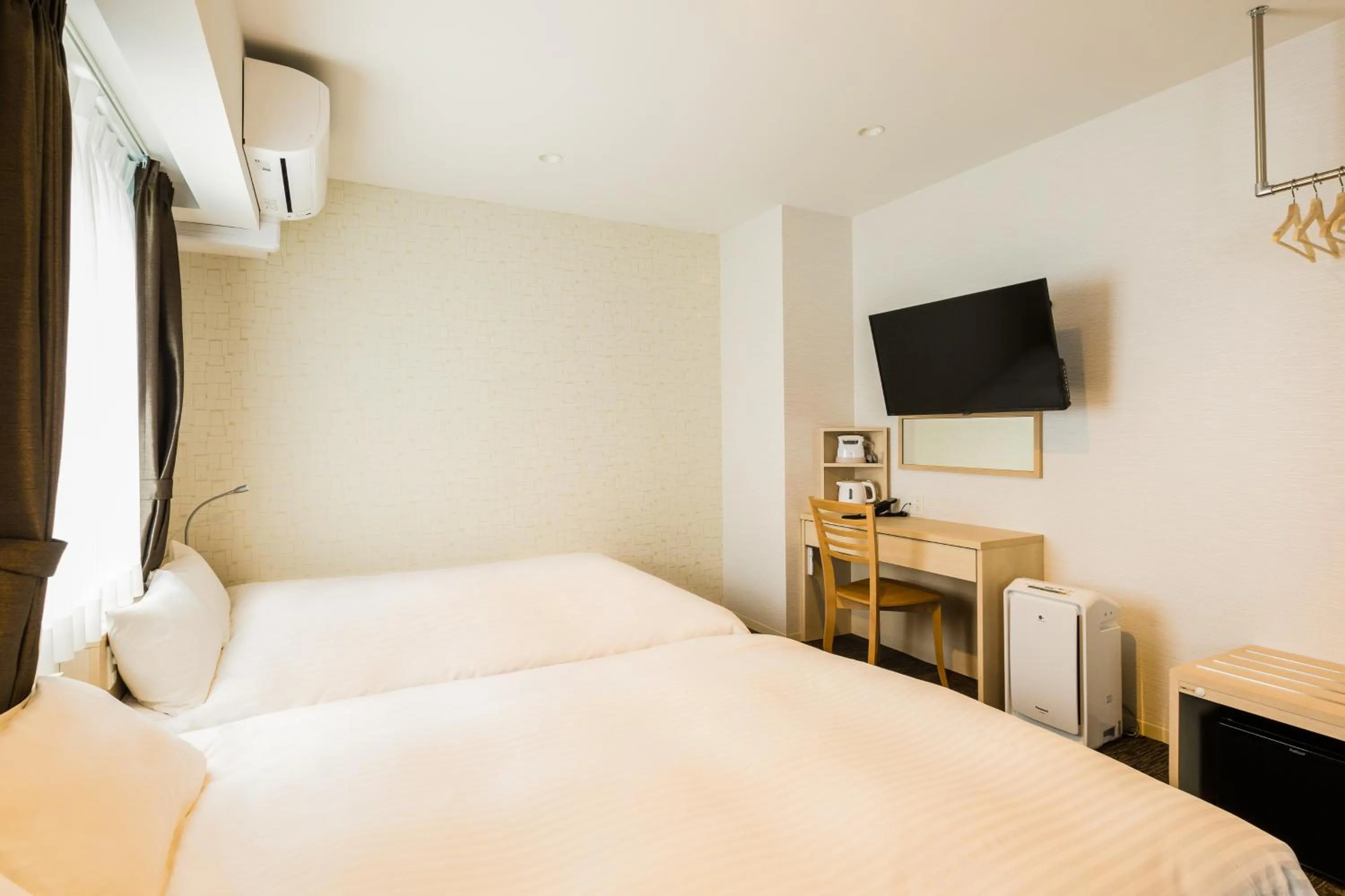 Photo of the whole room, Bed in EIWA PLACE HOTEL Hakata
