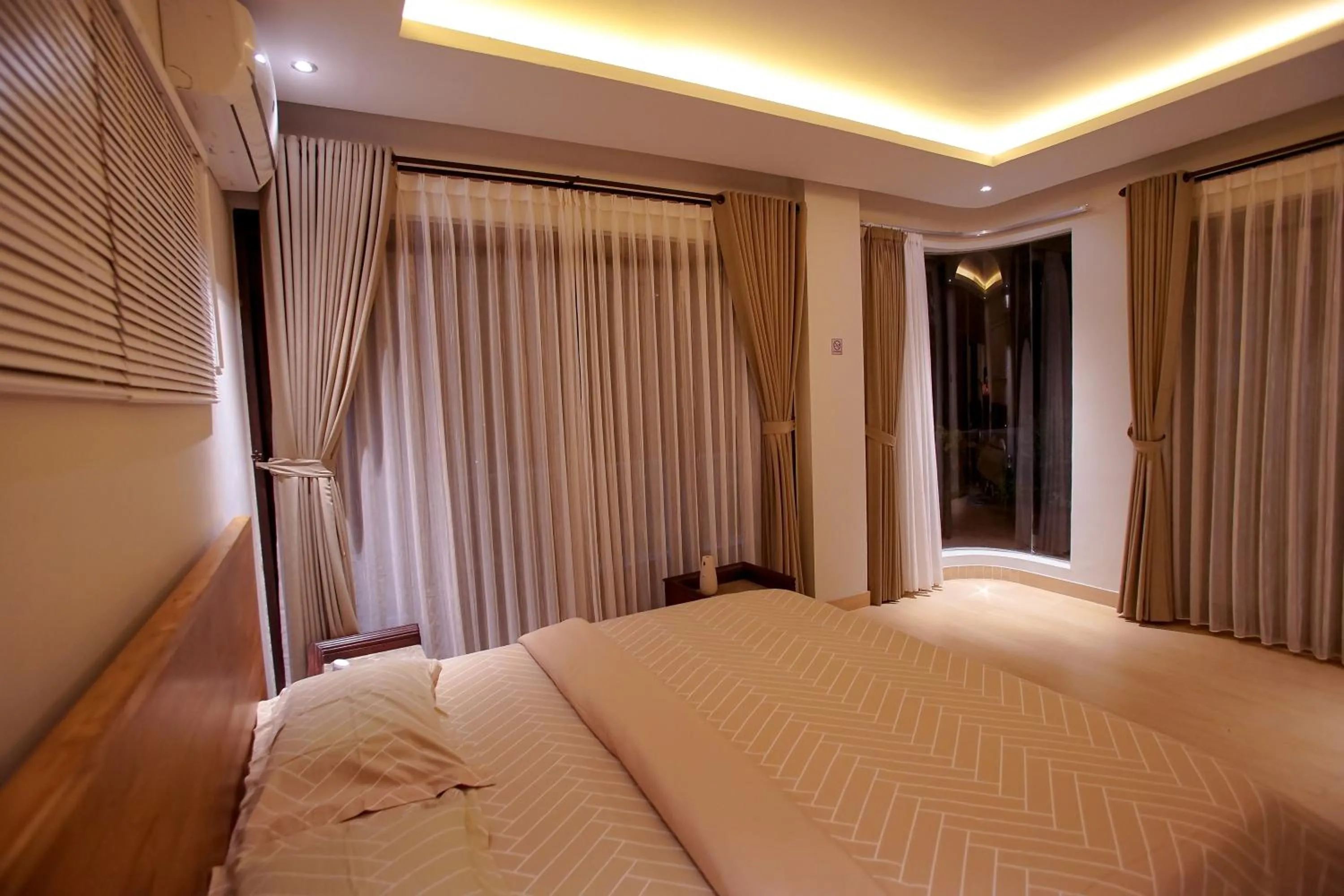 Bed in The Ocean Views Luxury Villas & Apartment