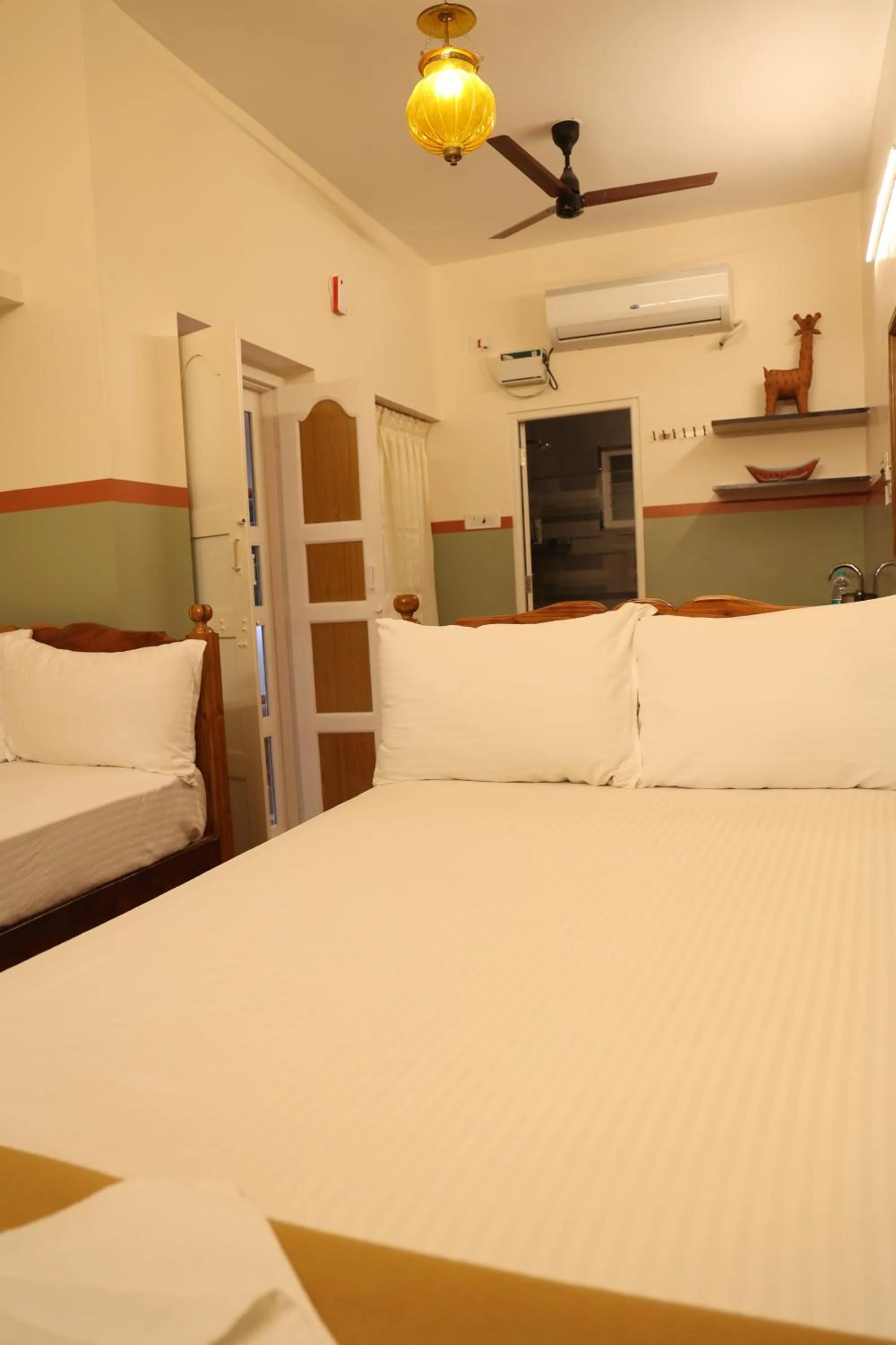 Photo of the whole room, Bed in Dwaraka Guest House