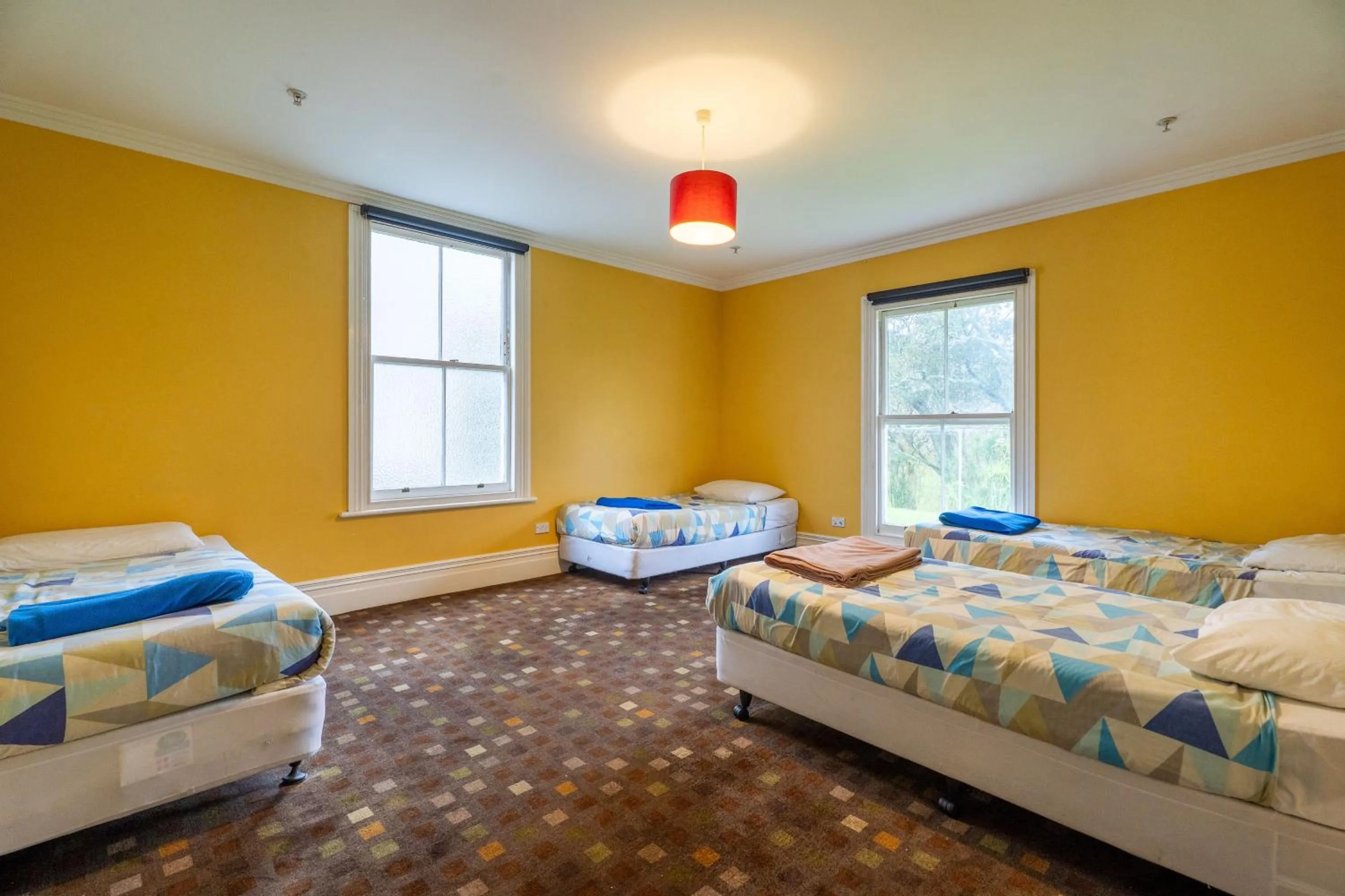 Bed in Verandahs Parkside Lodge