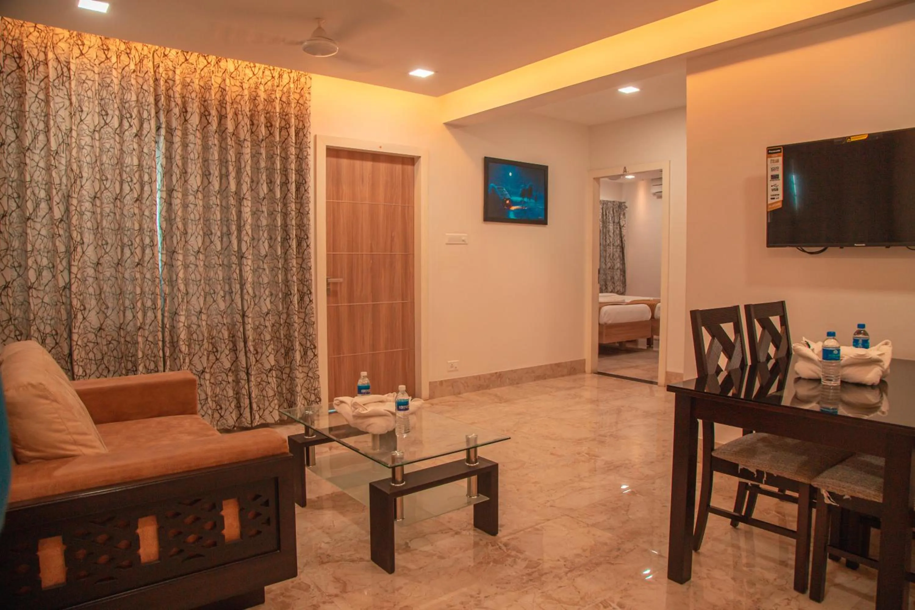 Living room, Bed in Park Avenue Suites