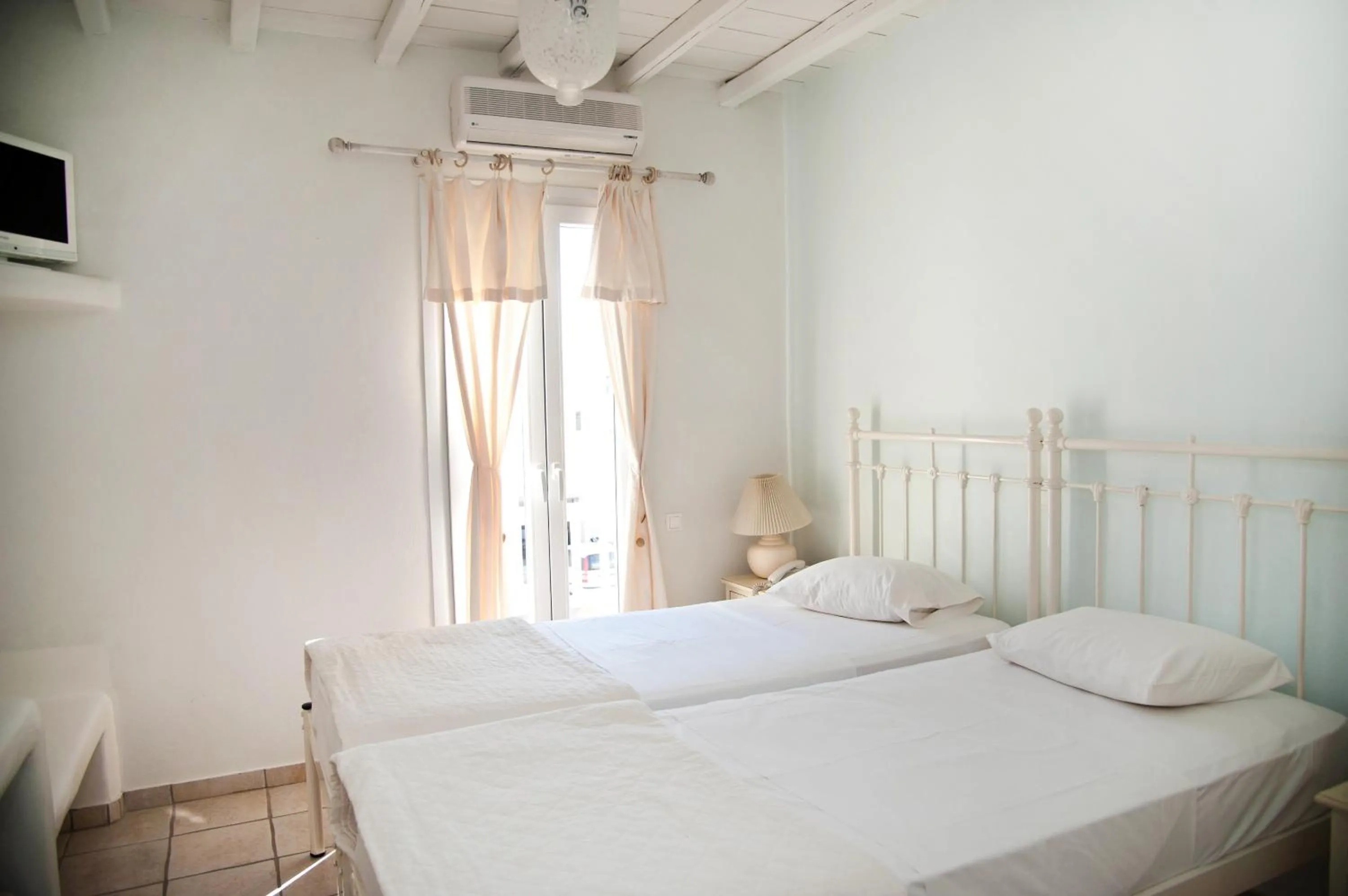 Bed in Altana Boutique Hotel