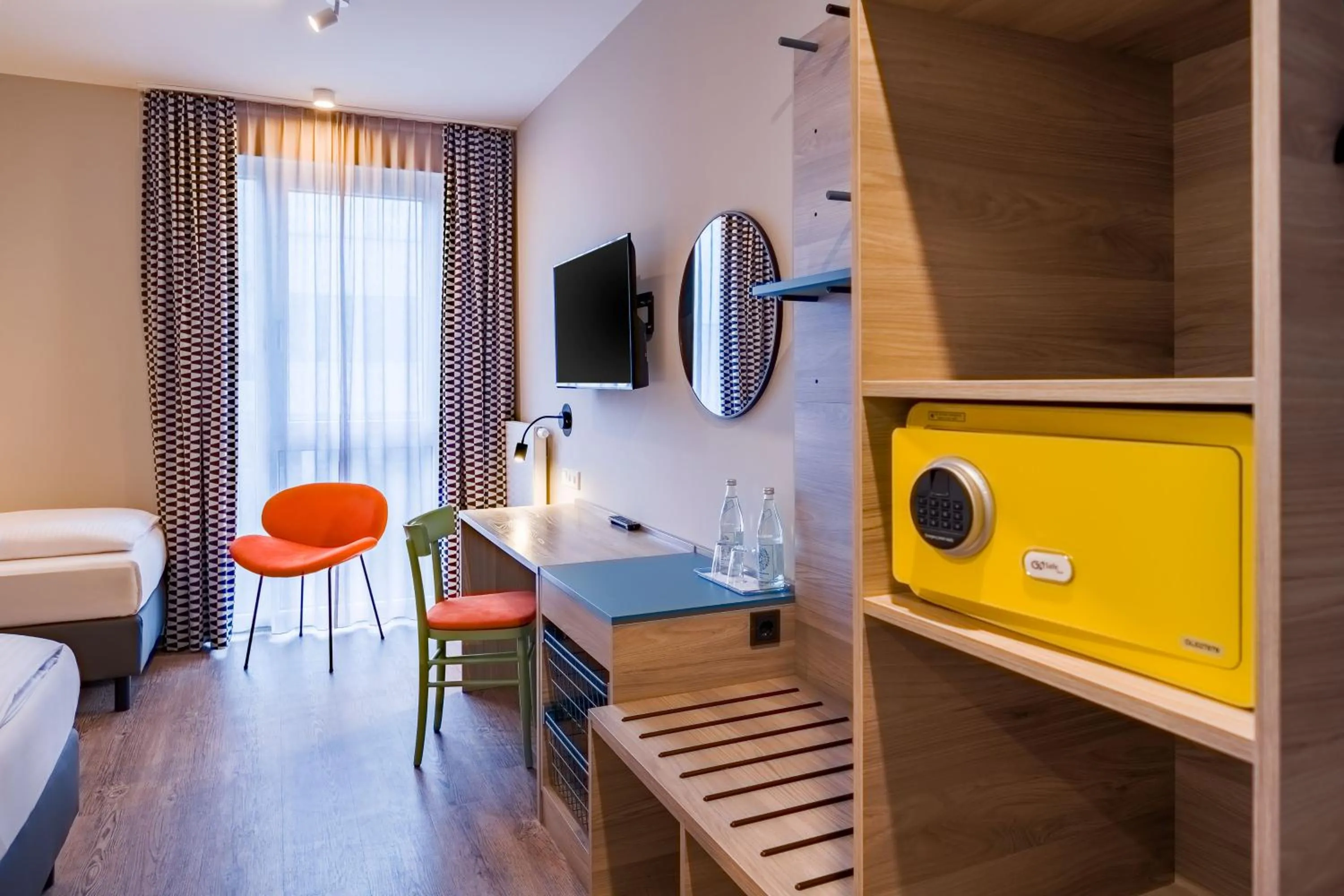 Seating area, Bed in Ramada Encore by Wyndham Munich Messe