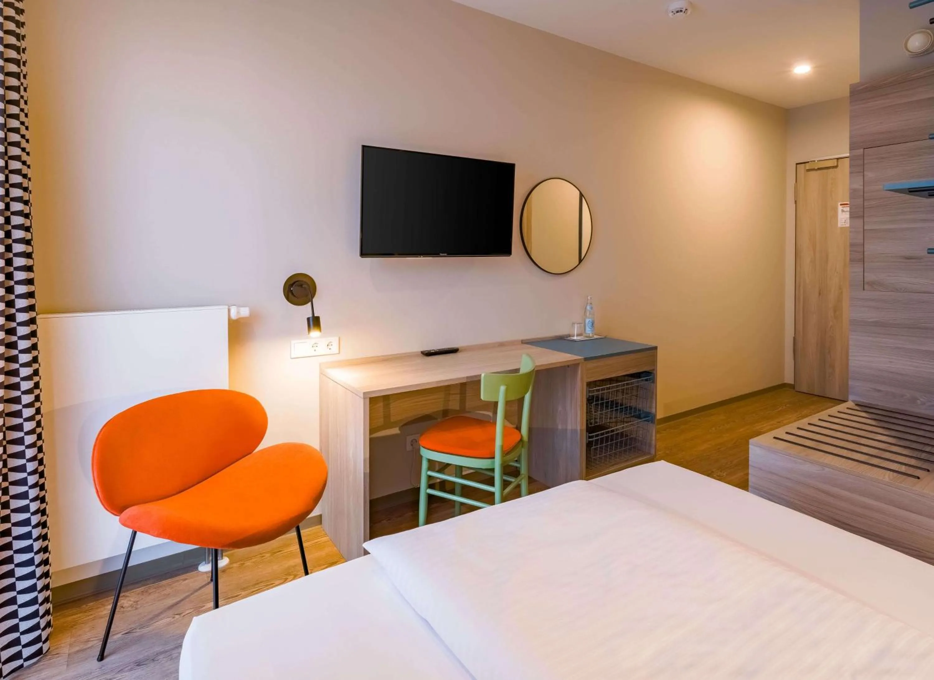 Photo of the whole room, Bed in Ramada Encore by Wyndham Munich Messe