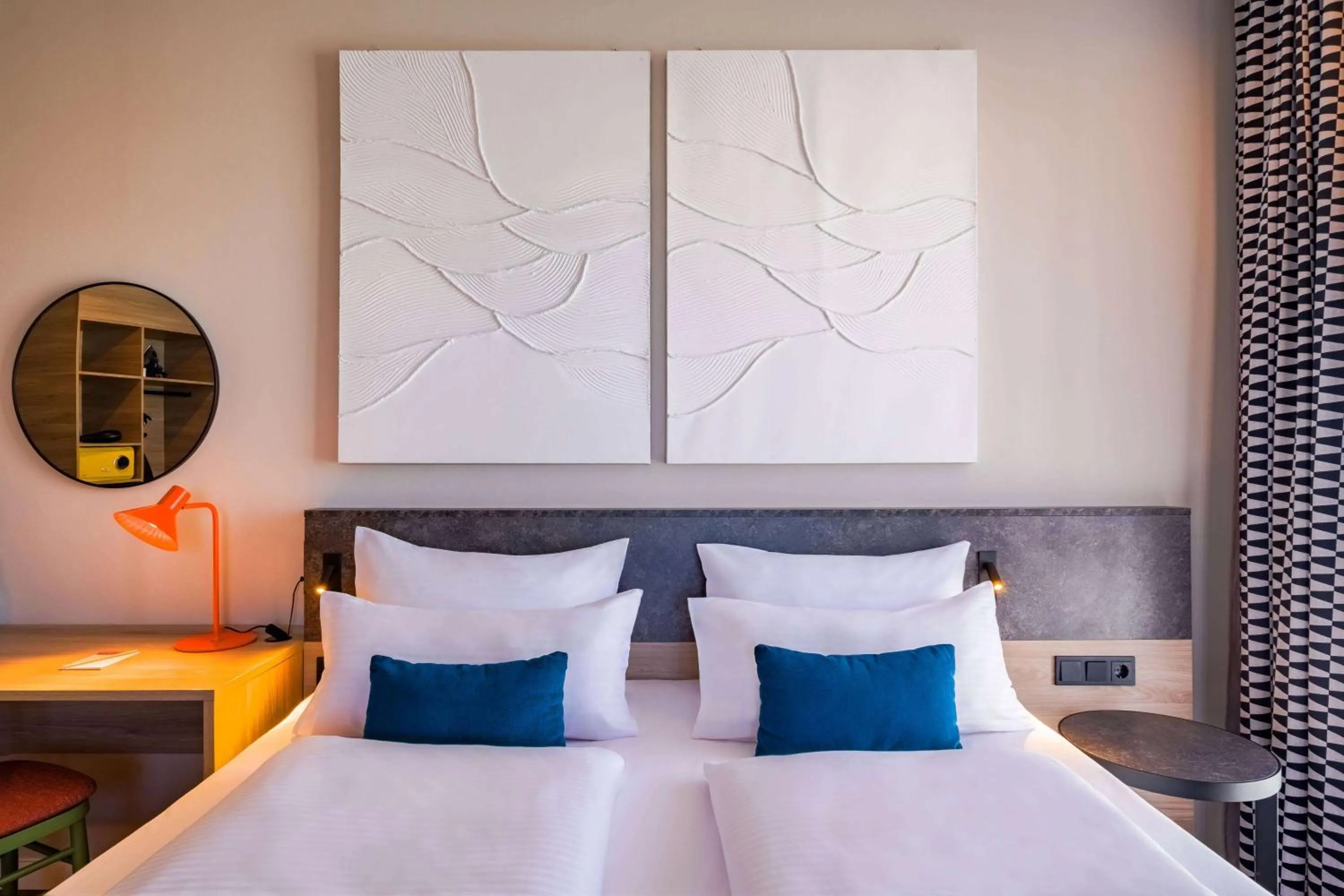 Photo of the whole room, Bed in Ramada Encore by Wyndham Munich Messe