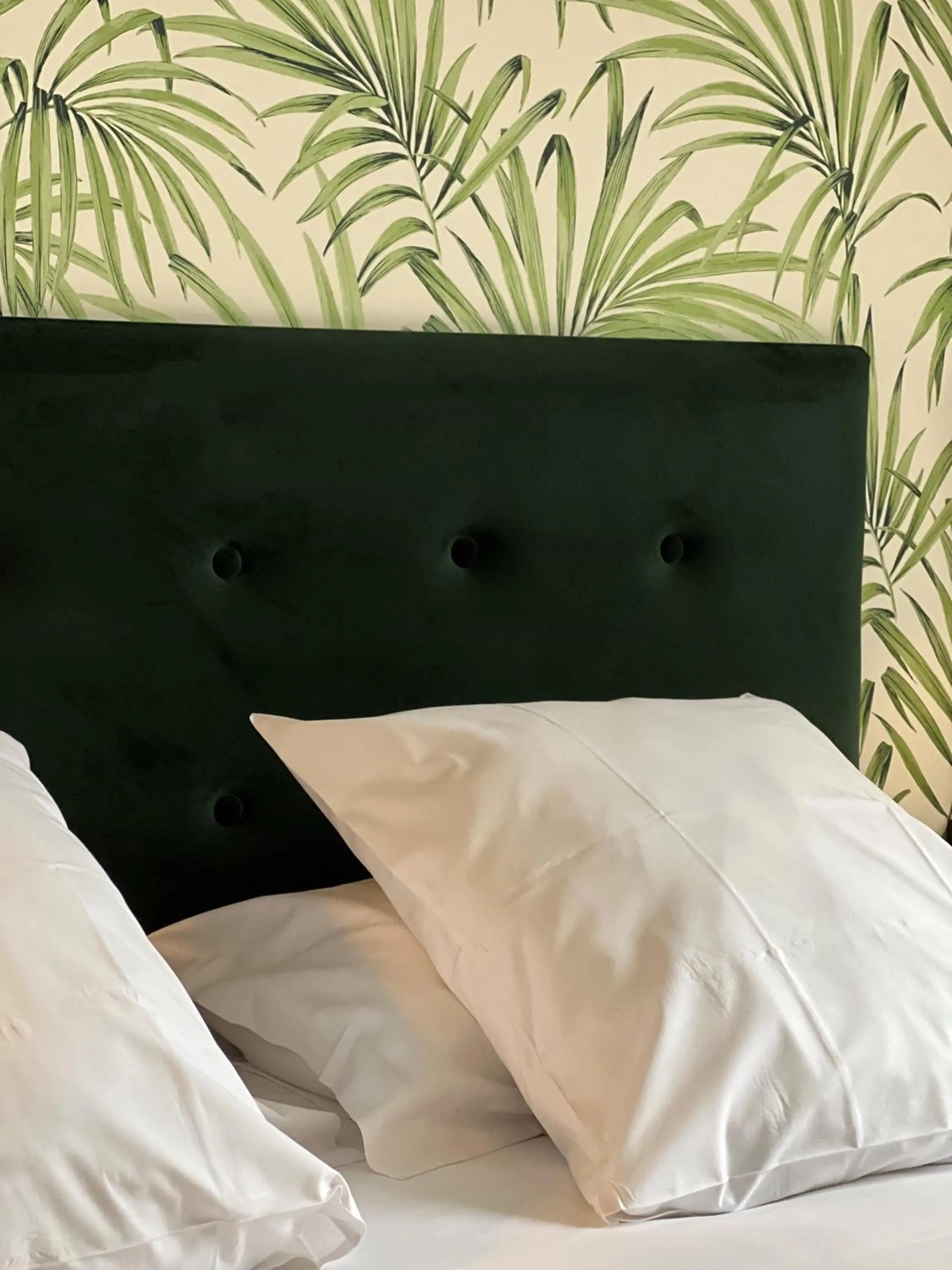 Bed in Logis Hotel du Maine