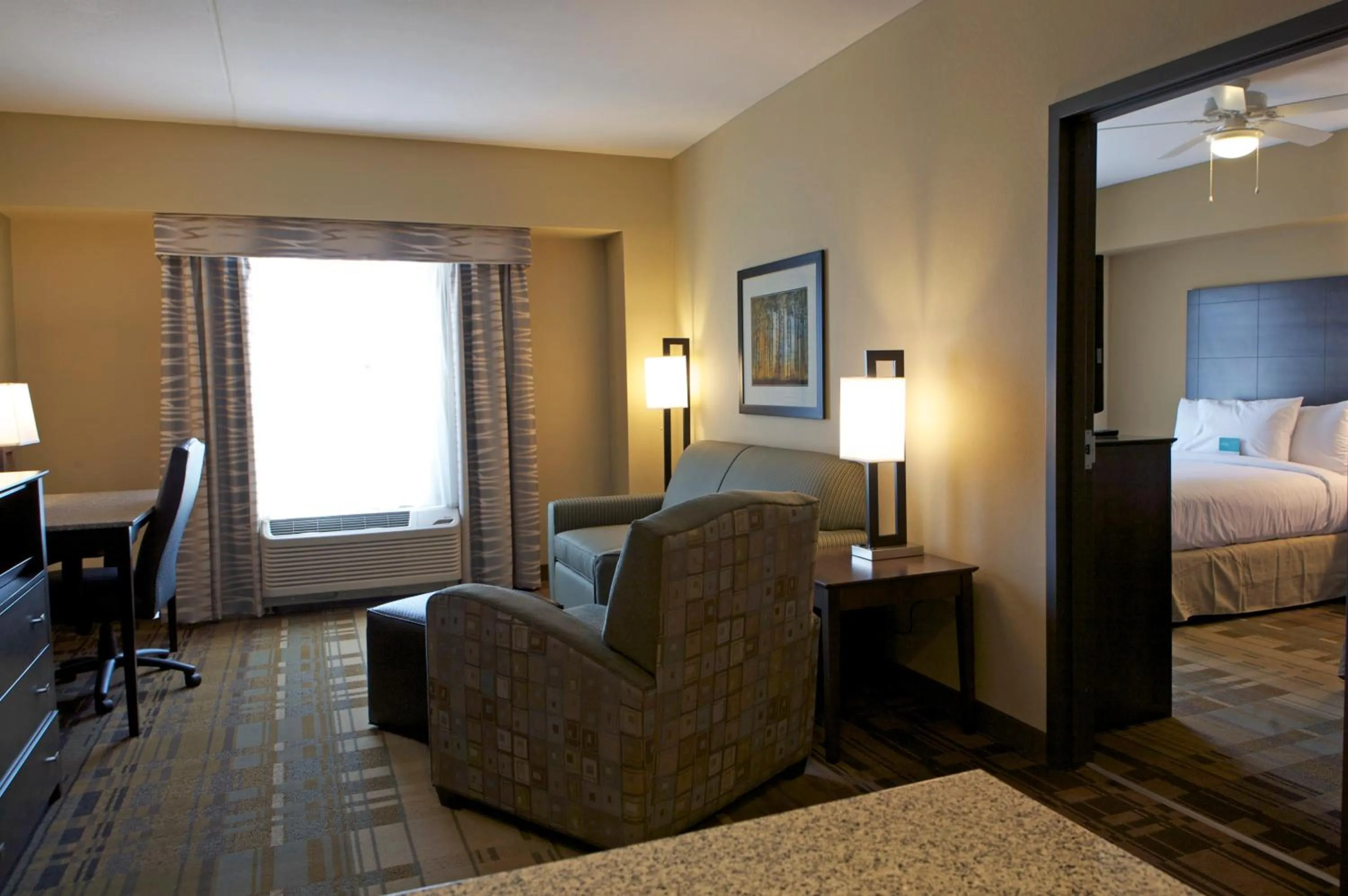Living room, Bed in Homewood Suites by Hilton Coralville - Iowa River Landing