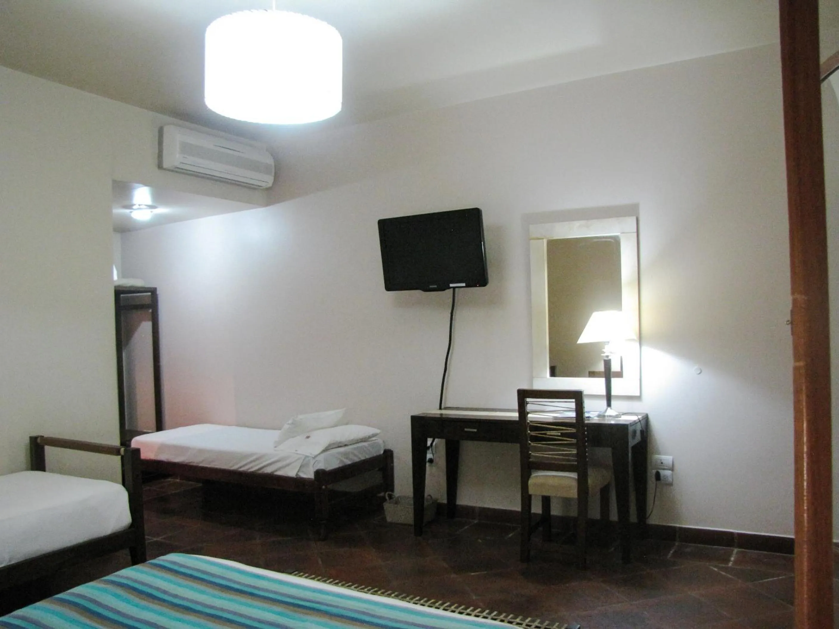 Bed in Hostería Posada del Sol