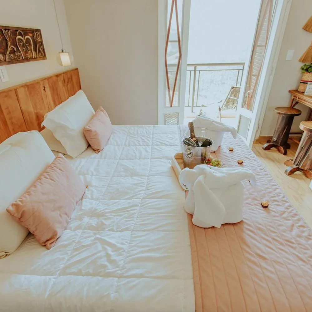 Bed in Hotel Pousada Shangri-la