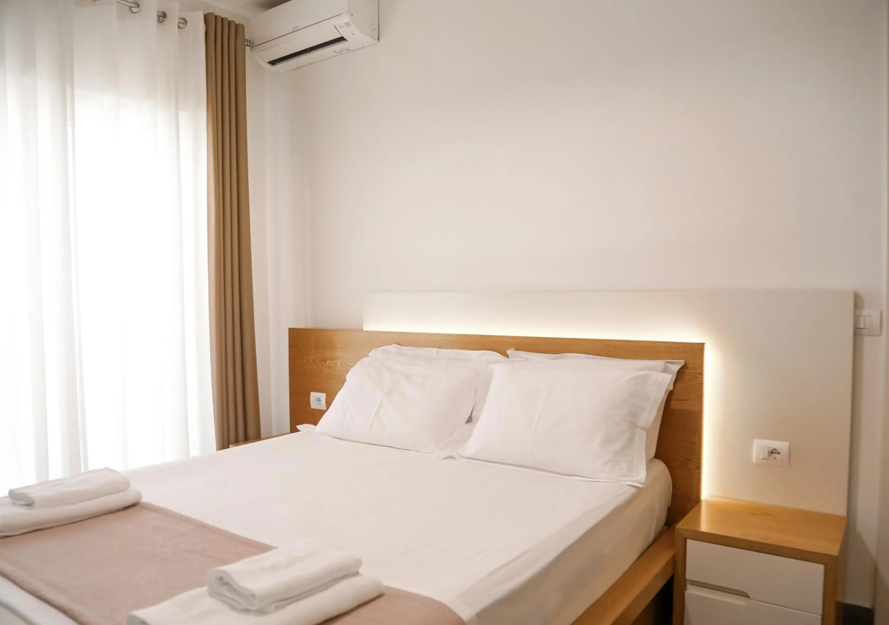 Bed in Sunrise Luxury Apartments