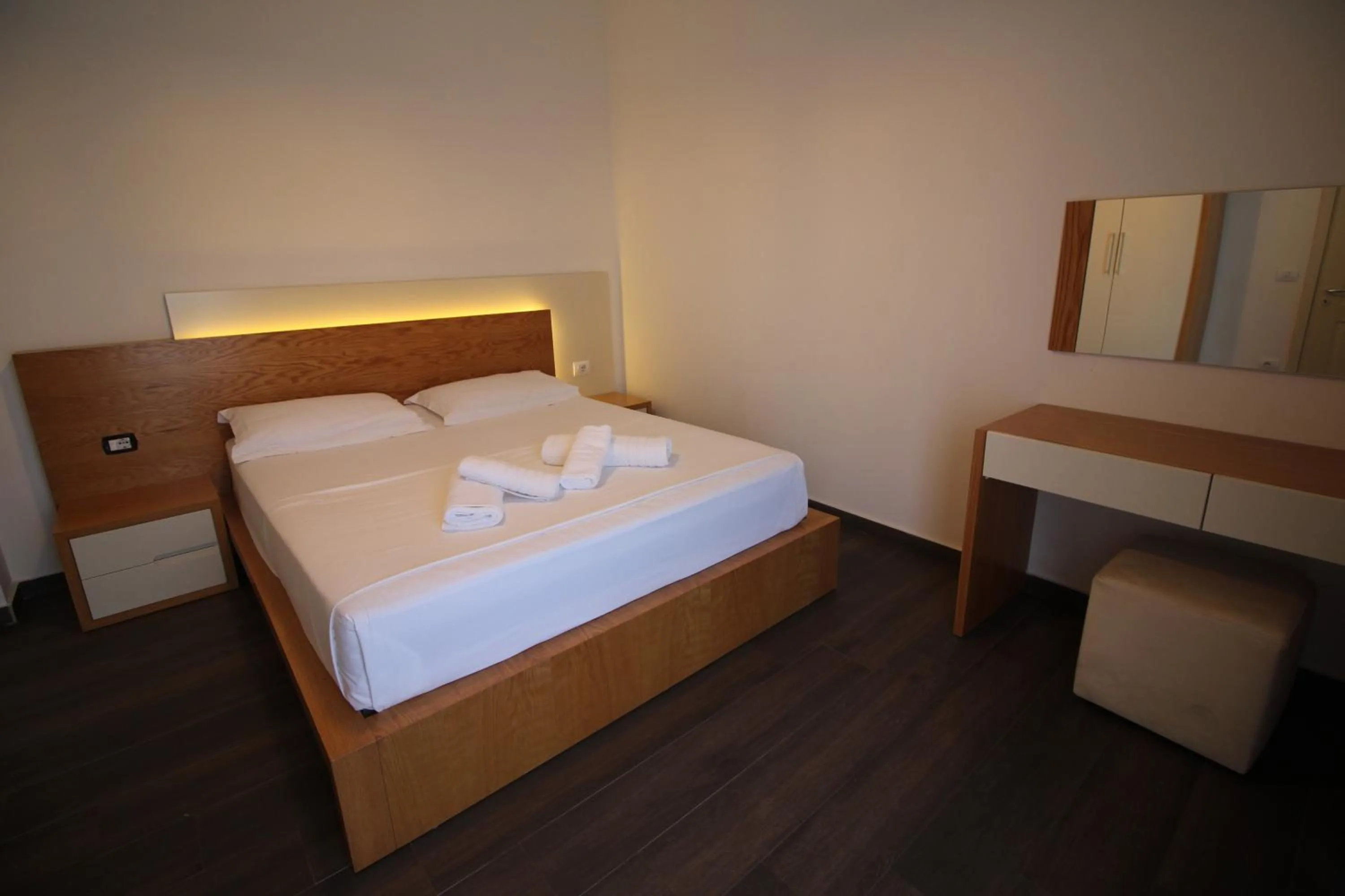 Bed in Sunrise Luxury Apartments