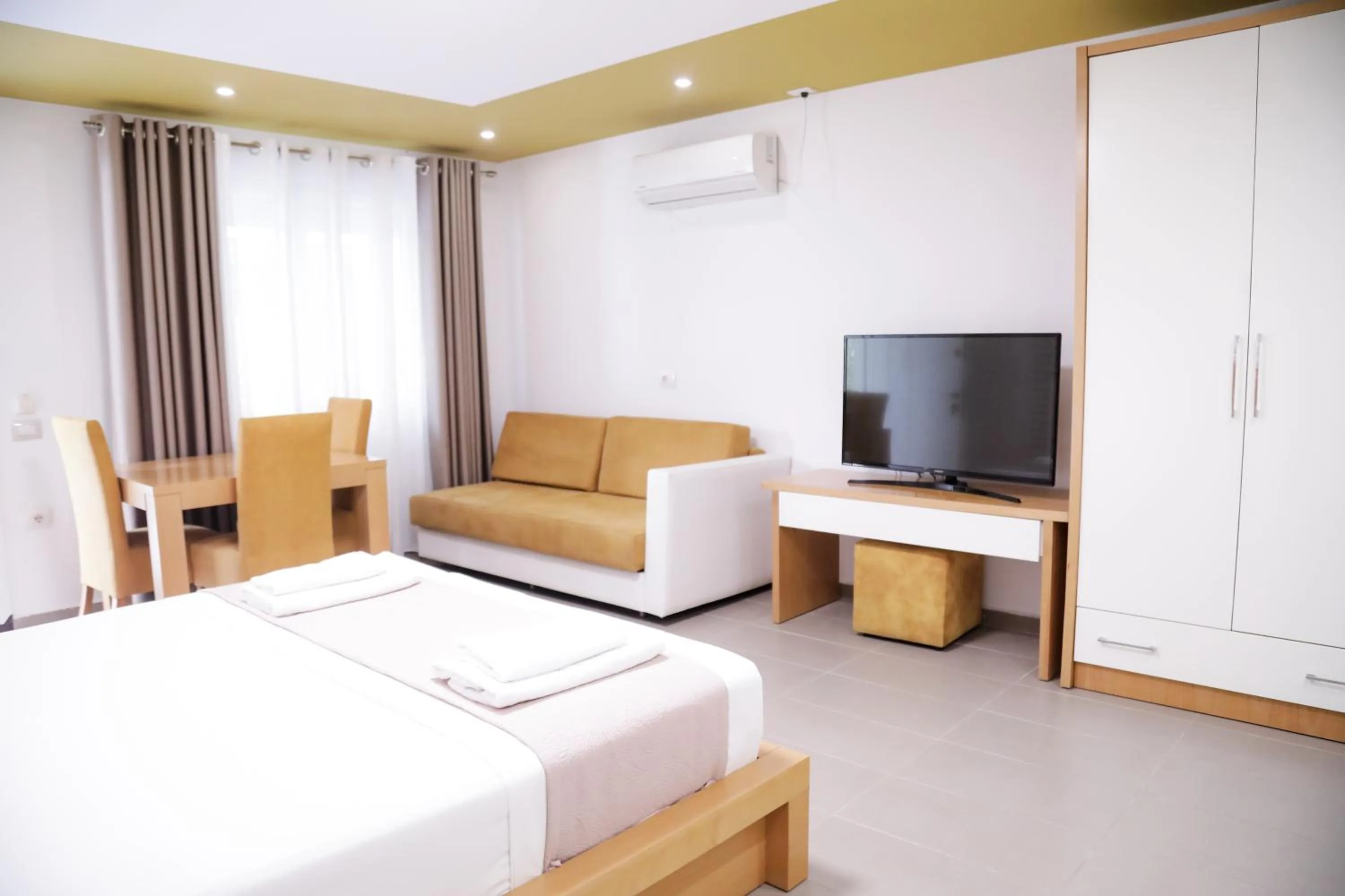 Bed in Sunrise Luxury Apartments