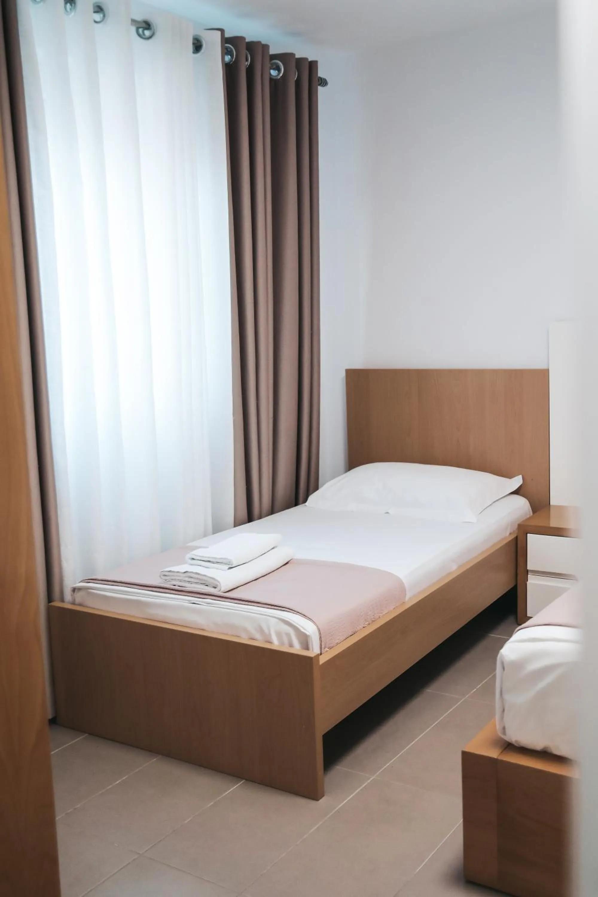 Bed in Sunrise Luxury Apartments