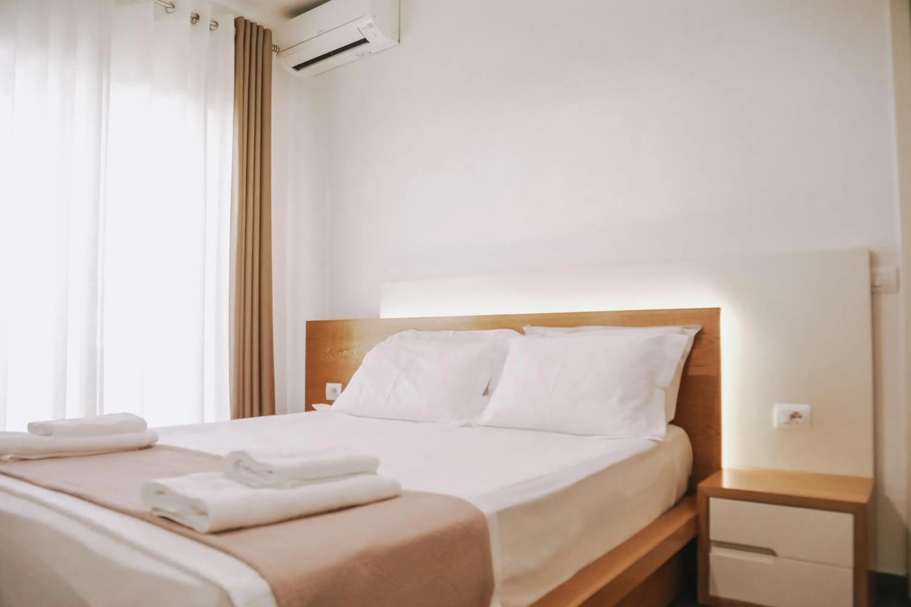 Bed in Sunrise Luxury Apartments