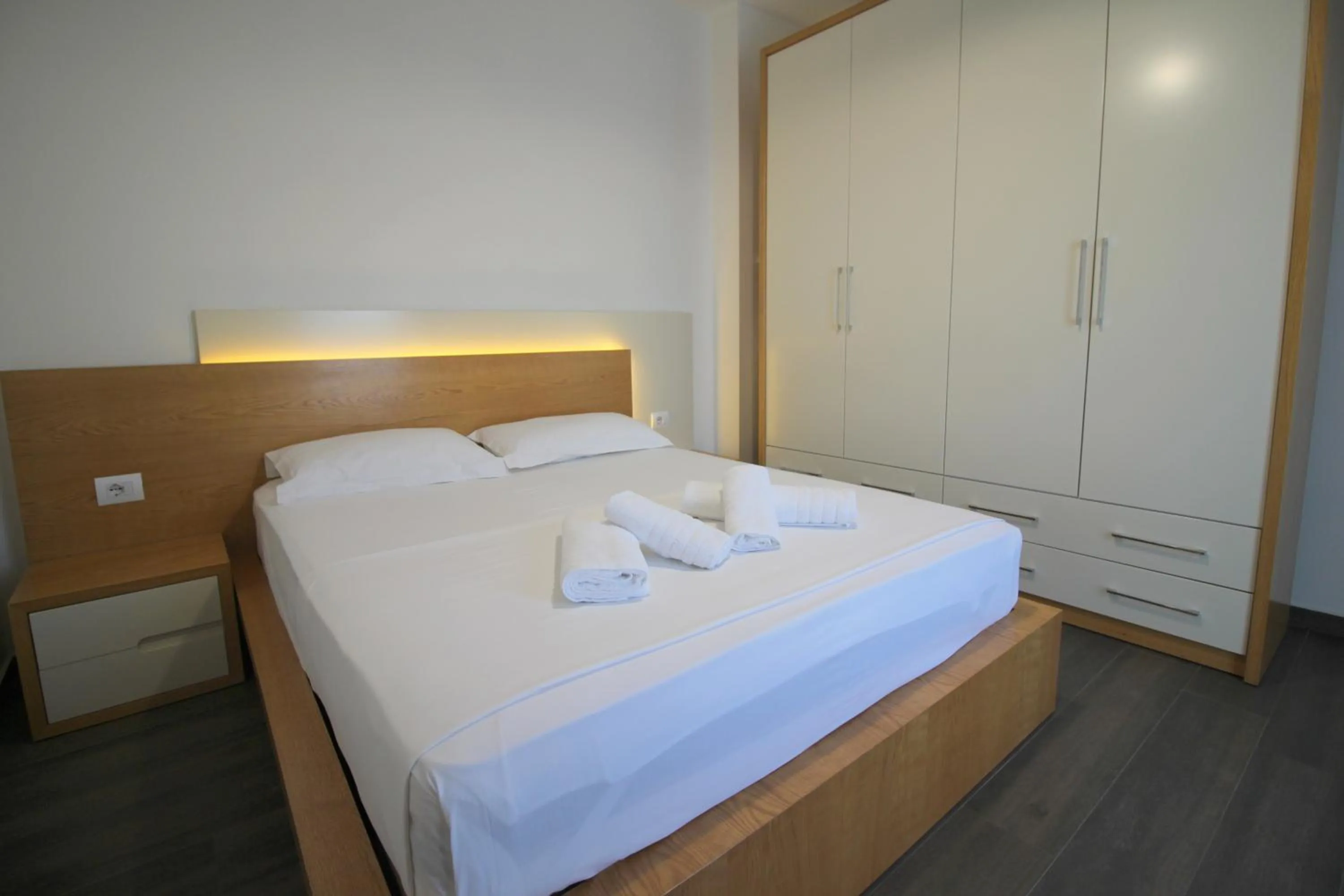 Bed in Sunrise Luxury Apartments