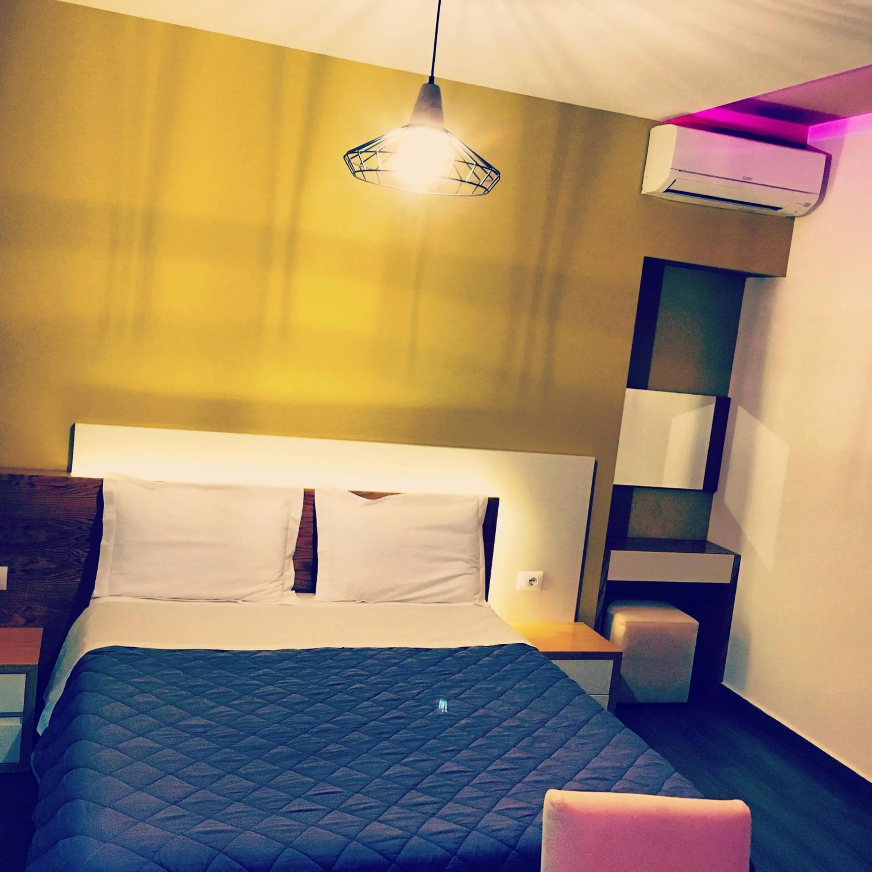 Bed in Sunrise Luxury Apartments