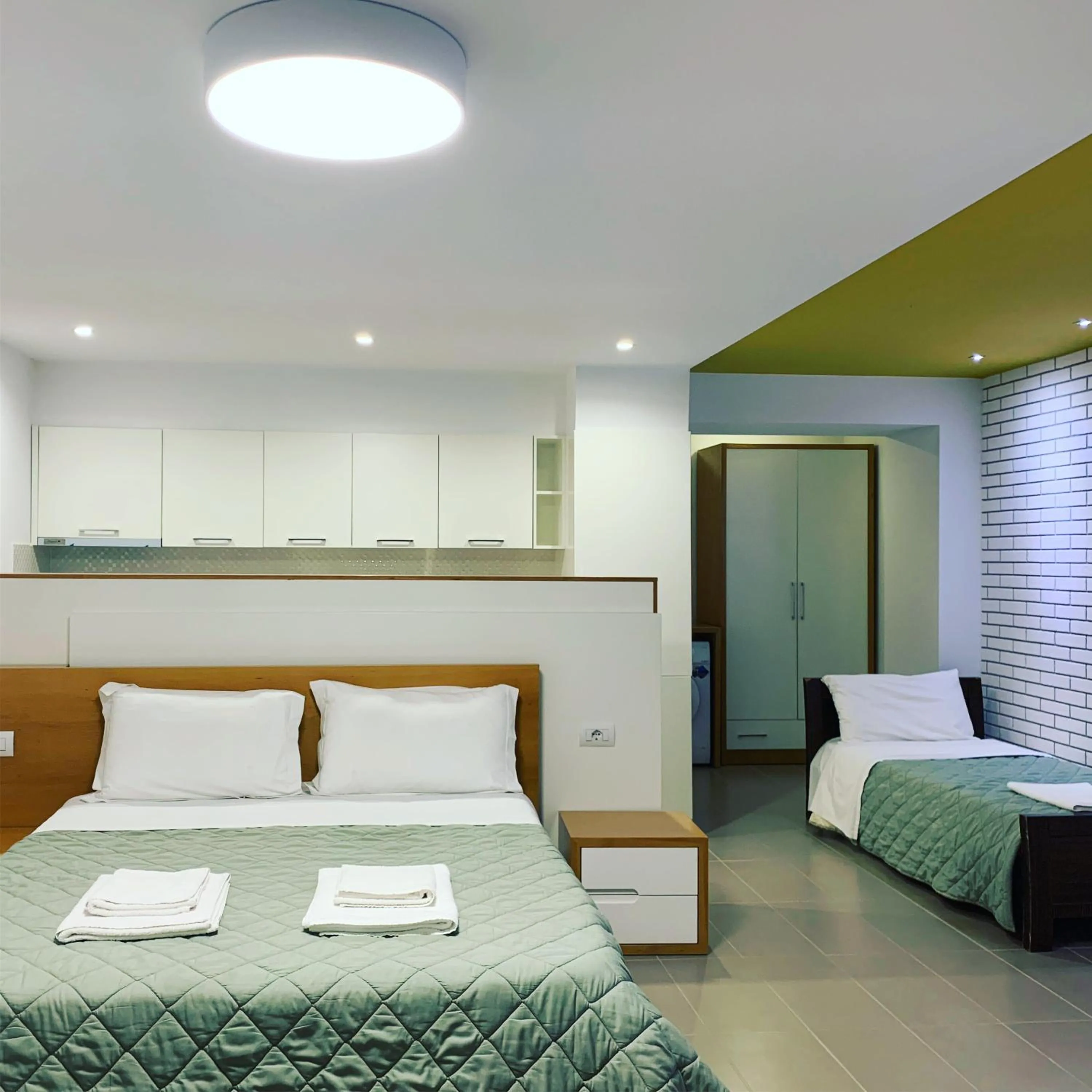 Bed in Sunrise Luxury Apartments