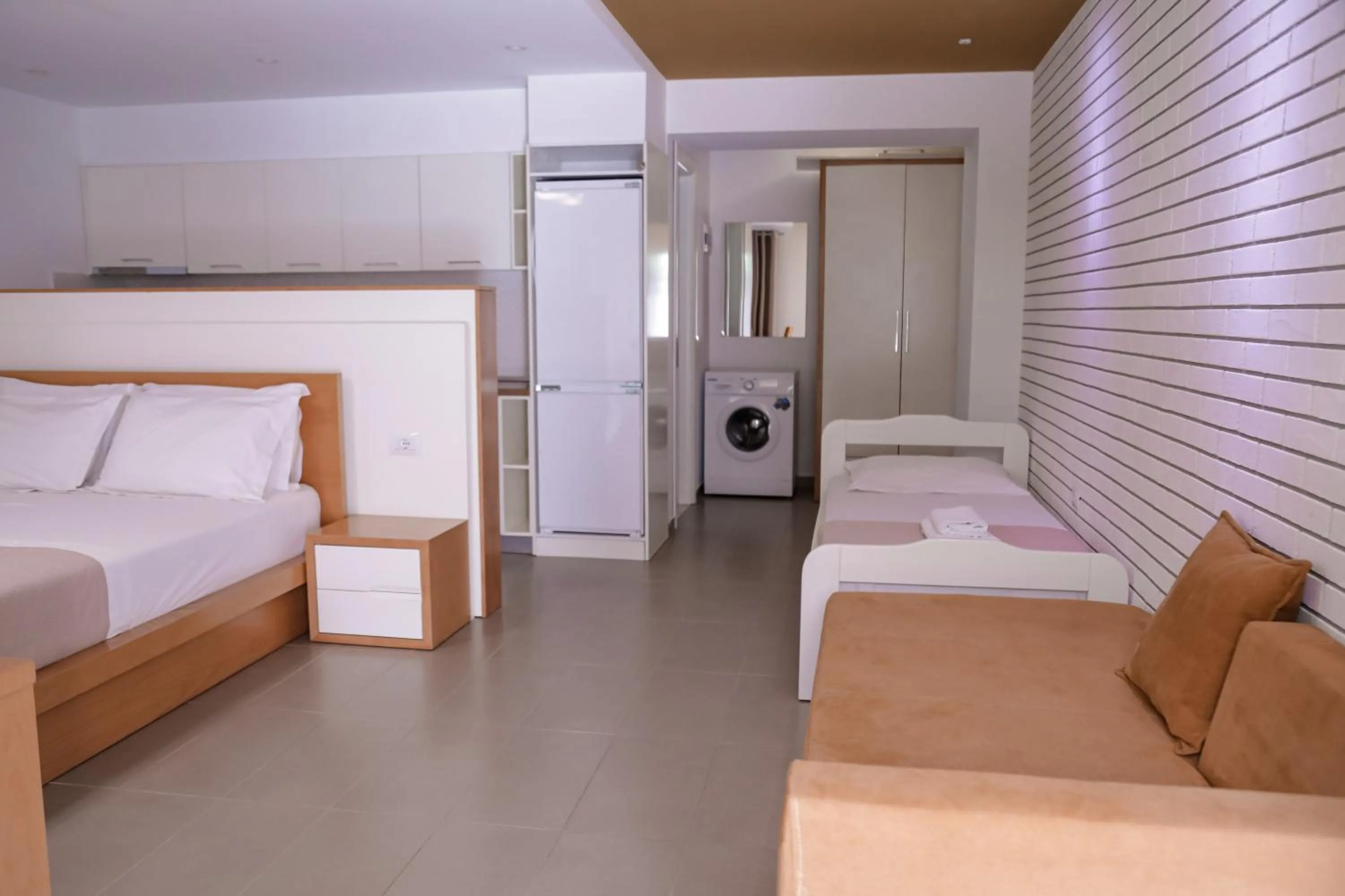 Bed in Sunrise Luxury Apartments