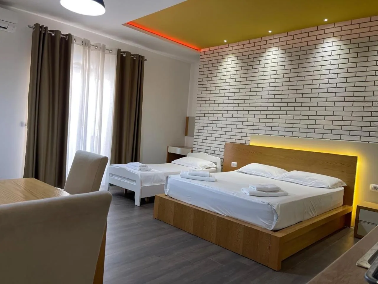 Bed in Sunrise Luxury Apartments