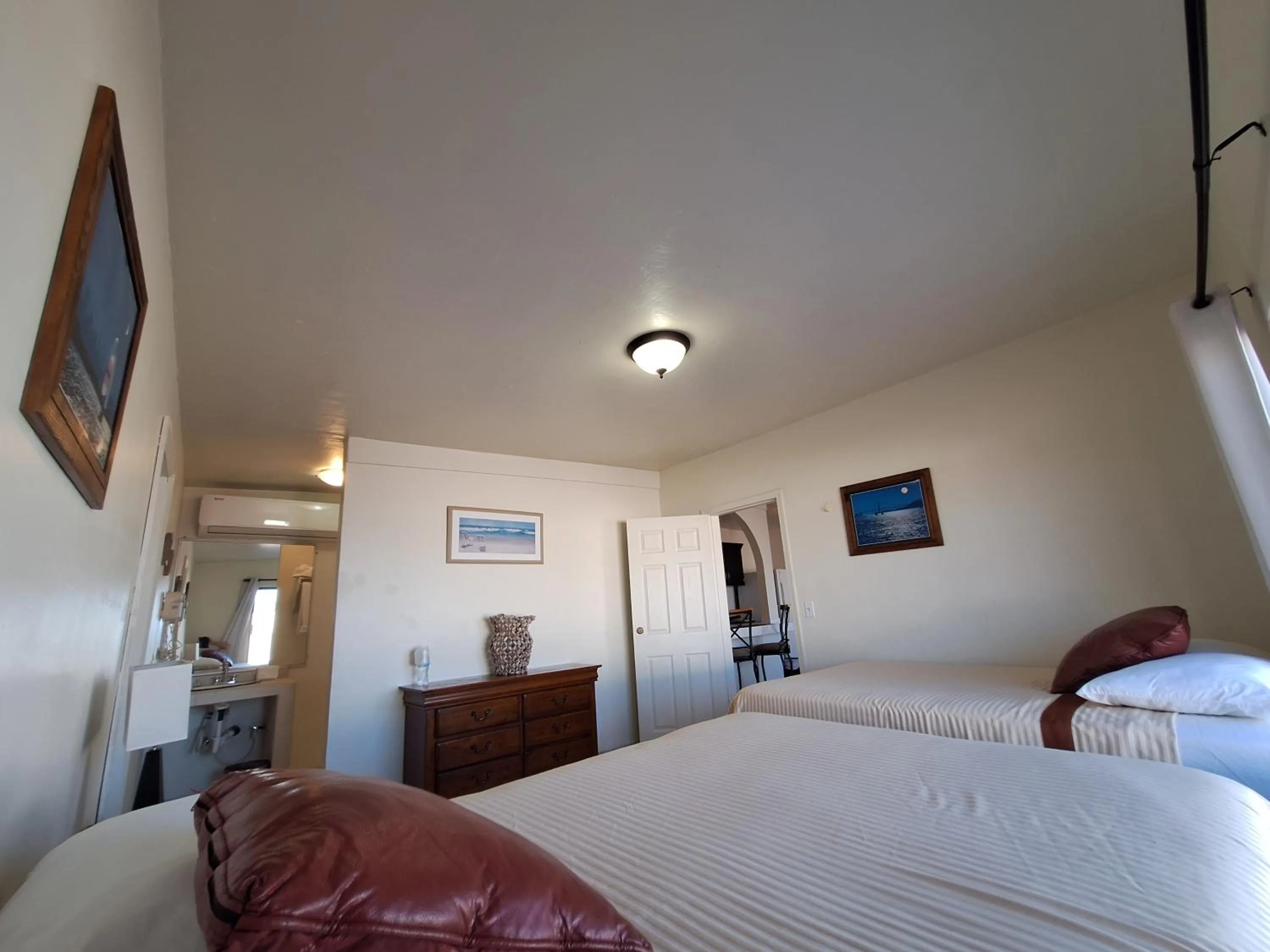 Bed in #55 Suite Bungalow Seaside Hotel & Victors RV Park