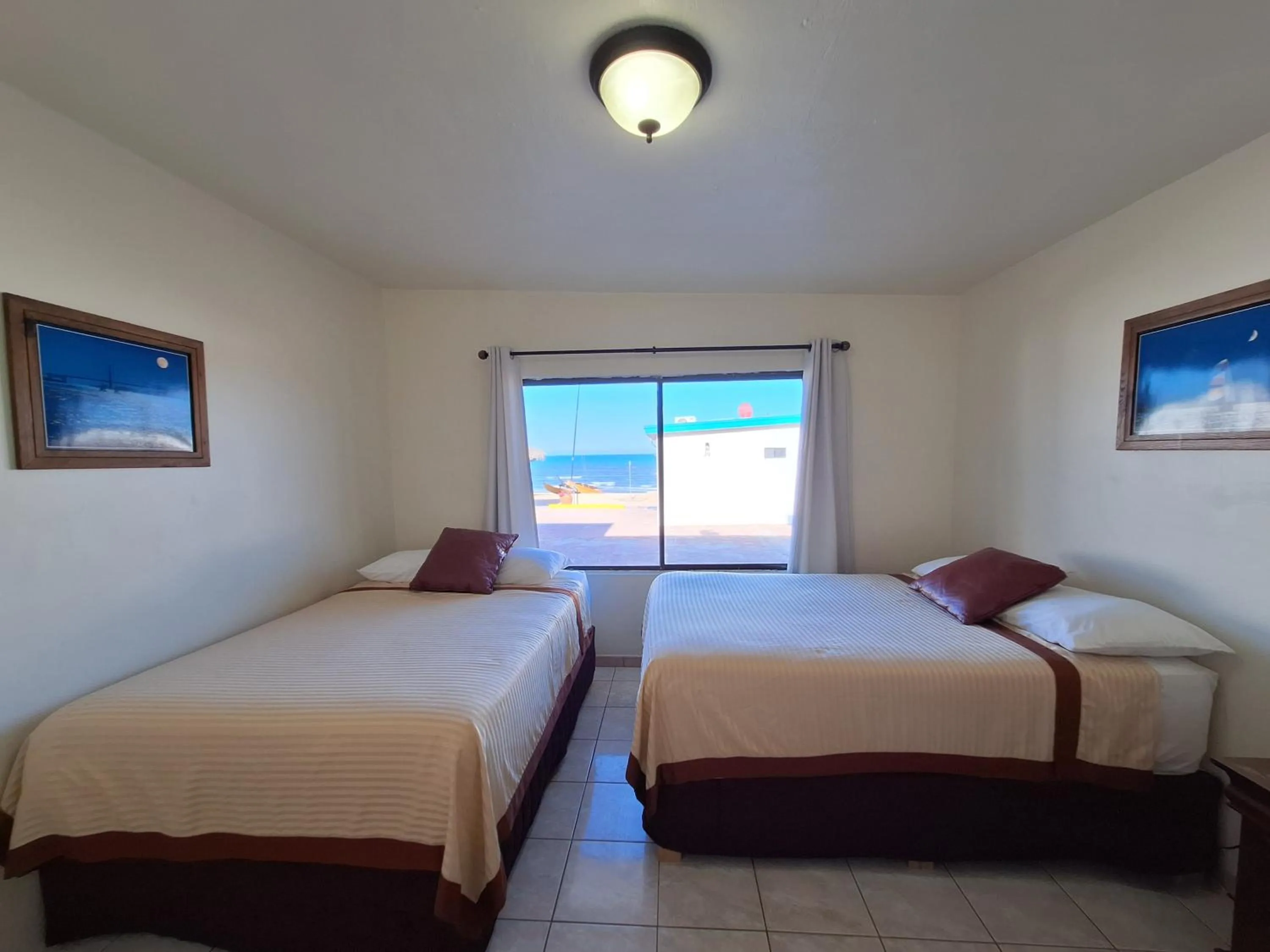 Bed in #55 Suite Bungalow Seaside Hotel & Victors RV Park