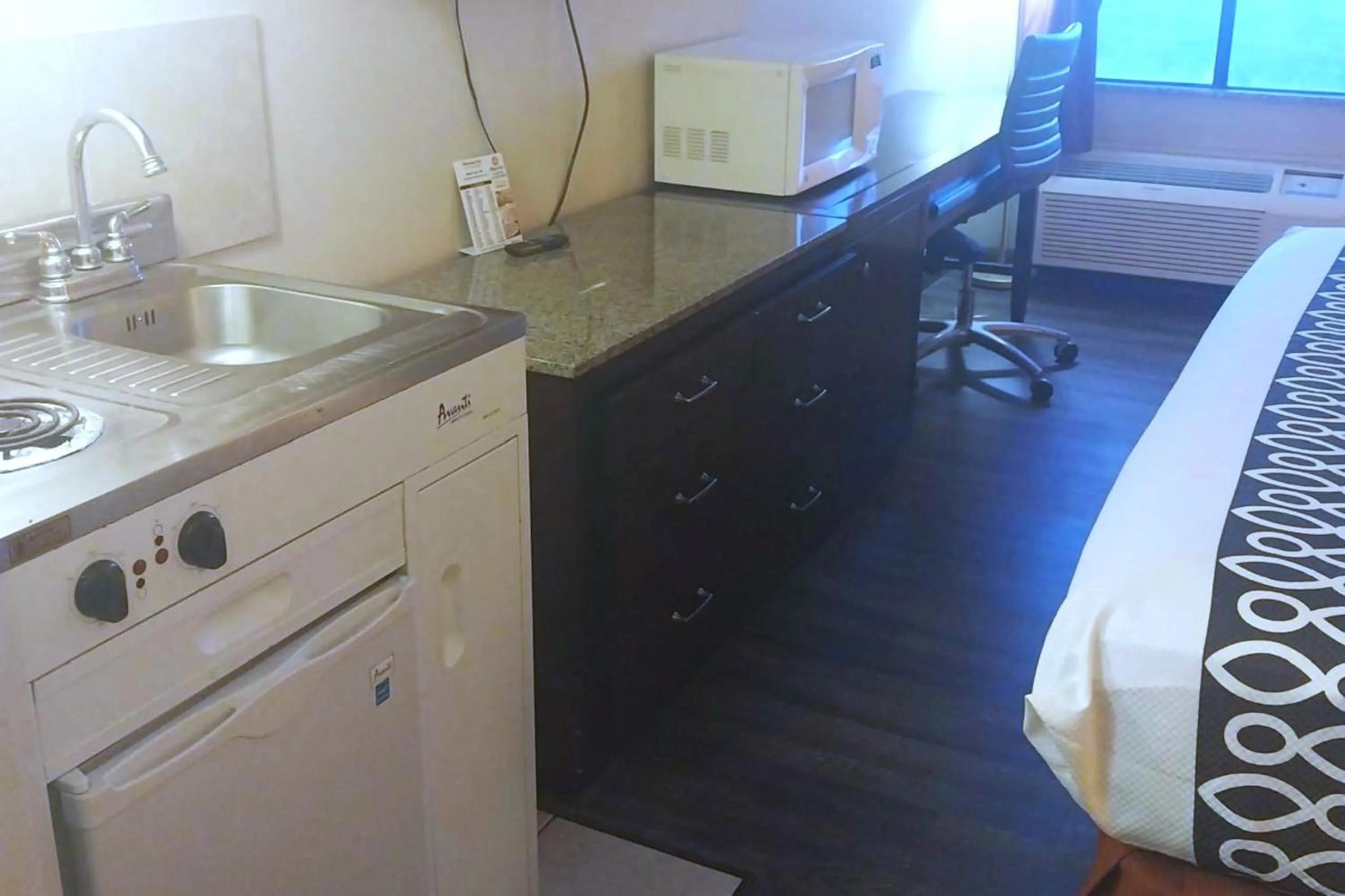 Kitchen or kitchenette in Capital O Fairway Inn - Baytown La Porte TX