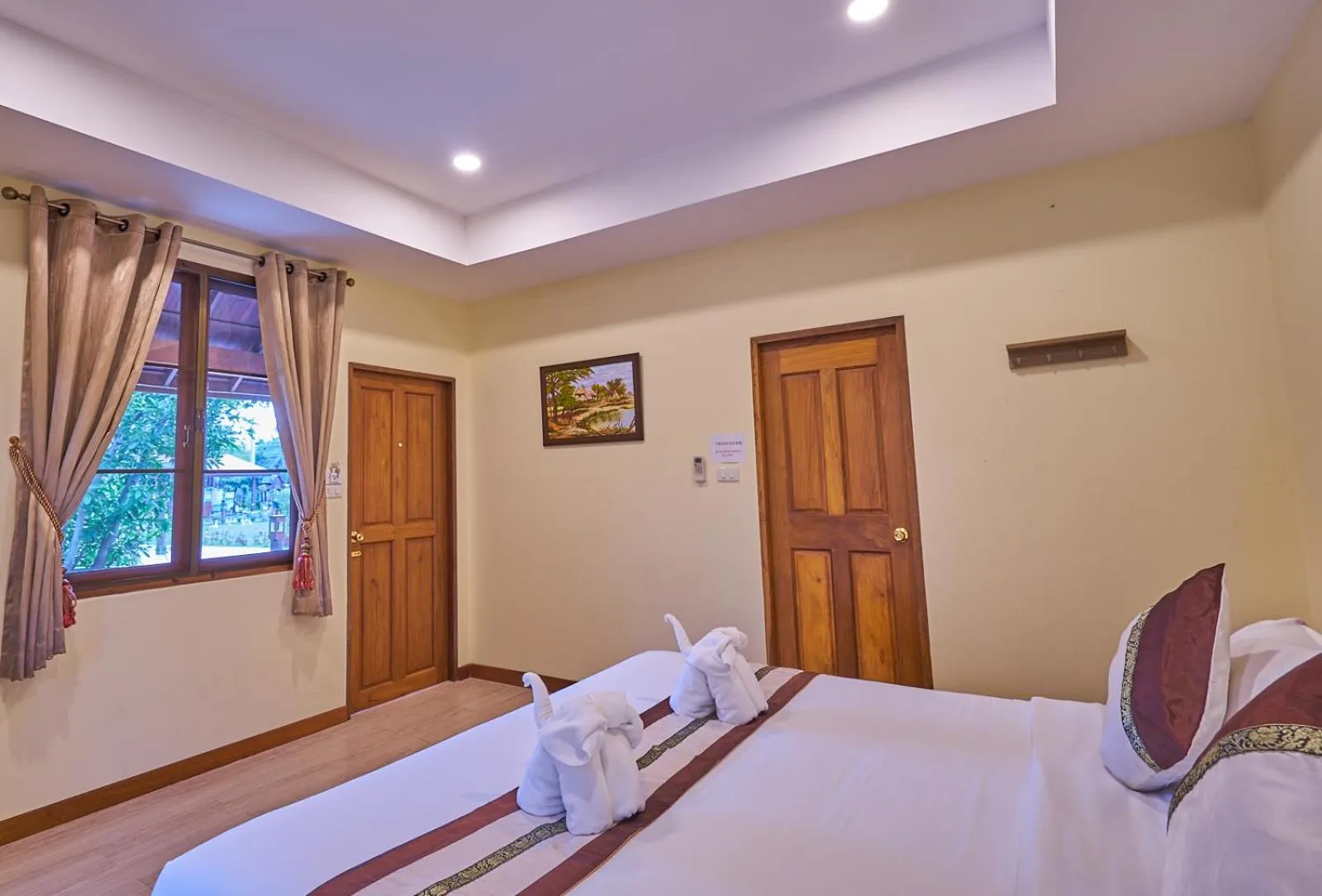 Bed in Mina Garden Villa Resort