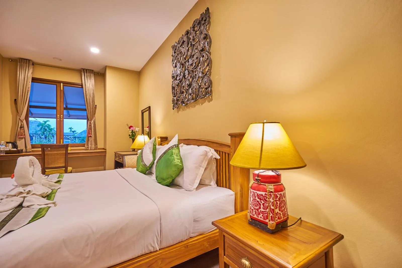 Bed in Mina Garden Villa Resort