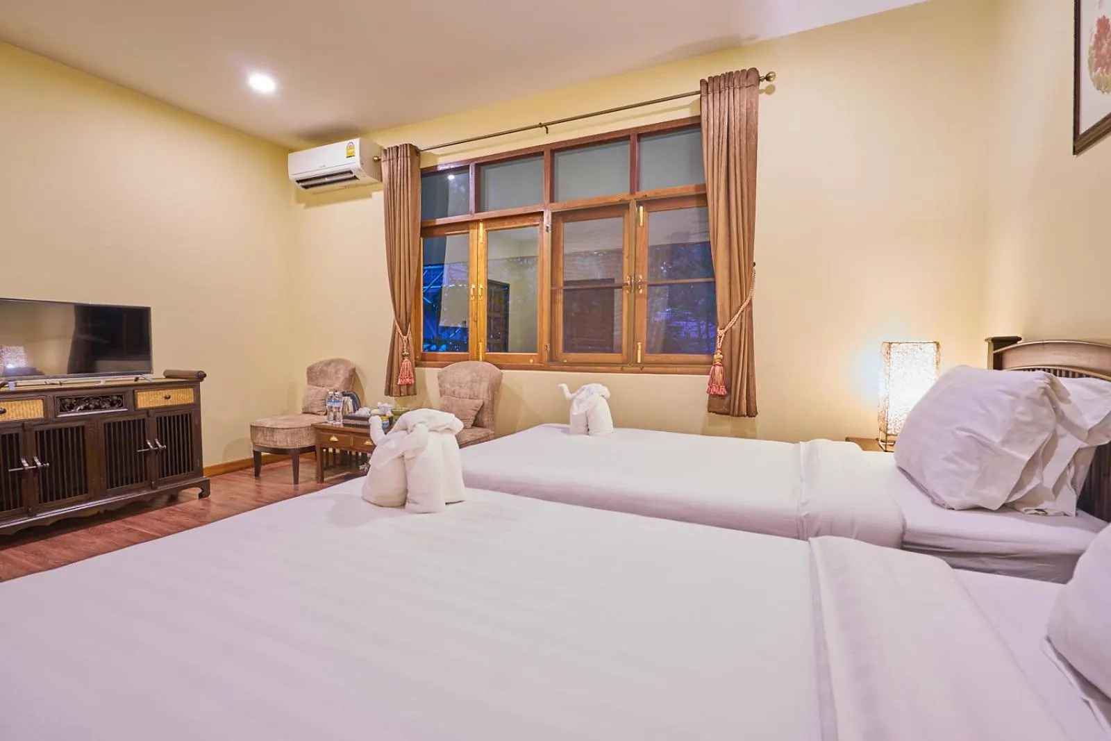 Bed in Mina Garden Villa Resort