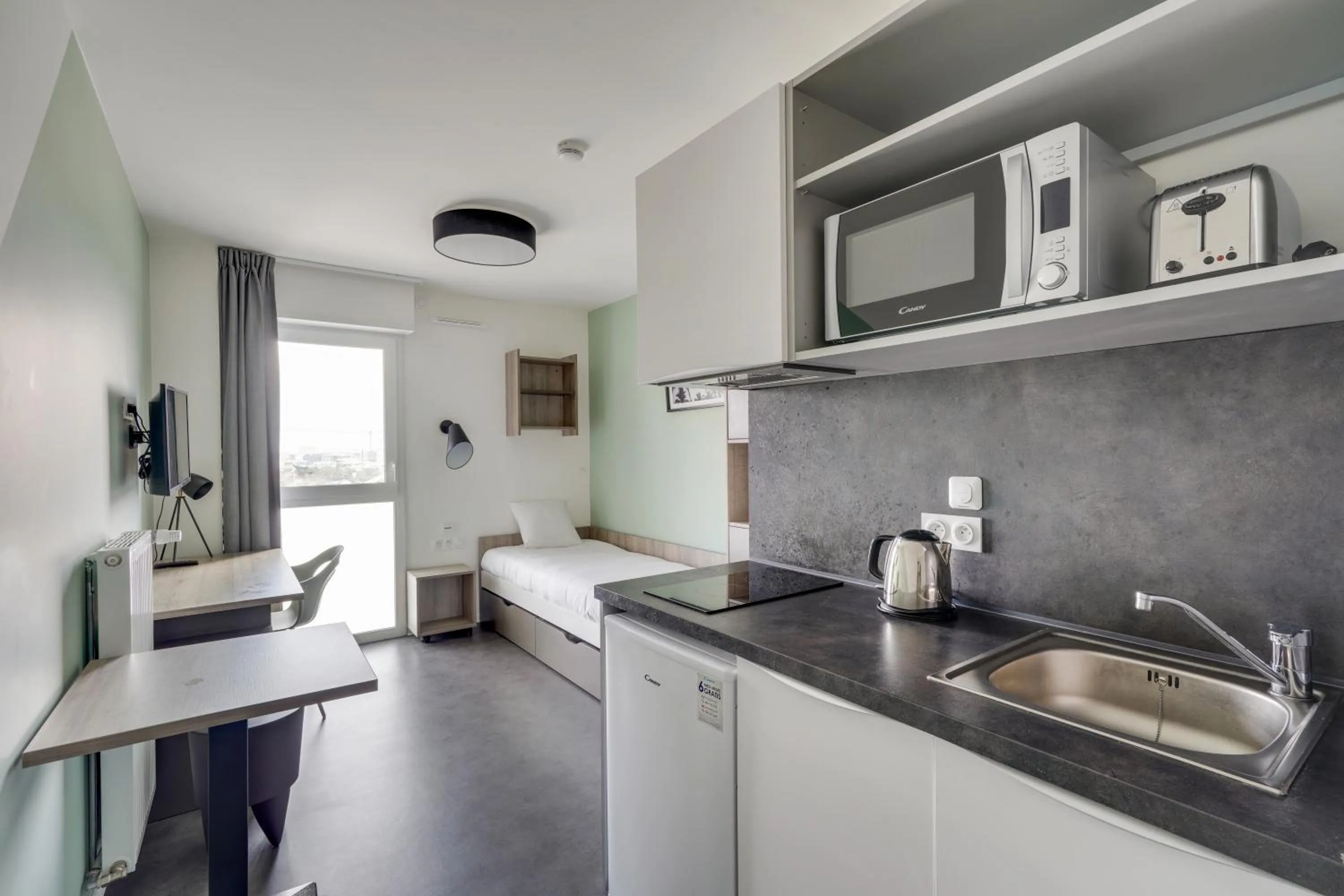 Kitchen or kitchenette in All Suites Appart Hôtel - Palaiseau - Massy TGV