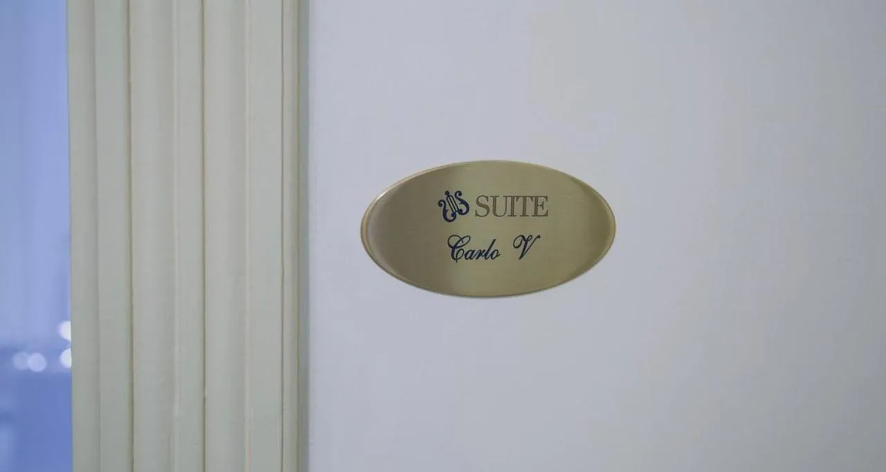 Property logo or sign in Apollo Suites