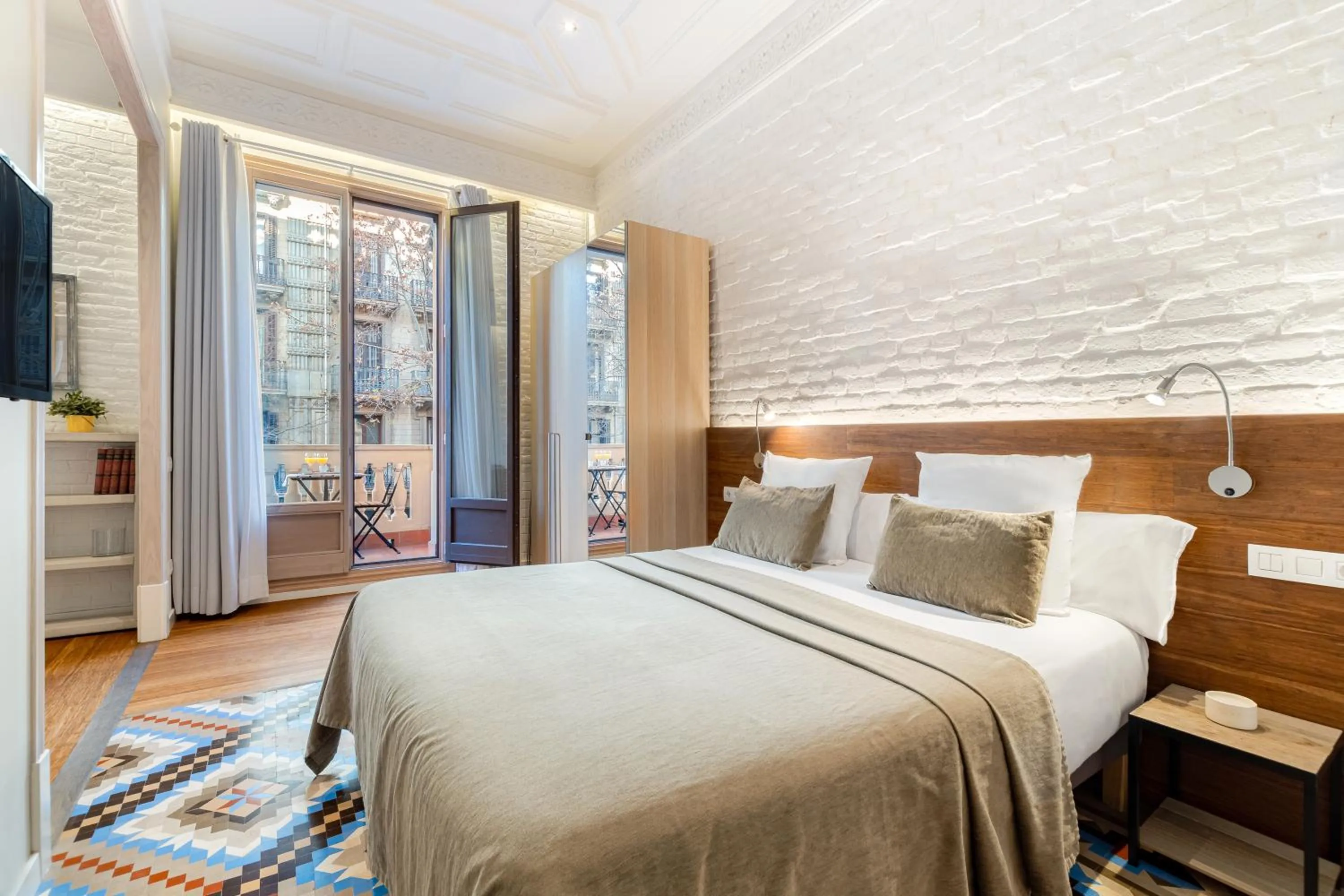 Bed in Fuster Apartments by Aspasios