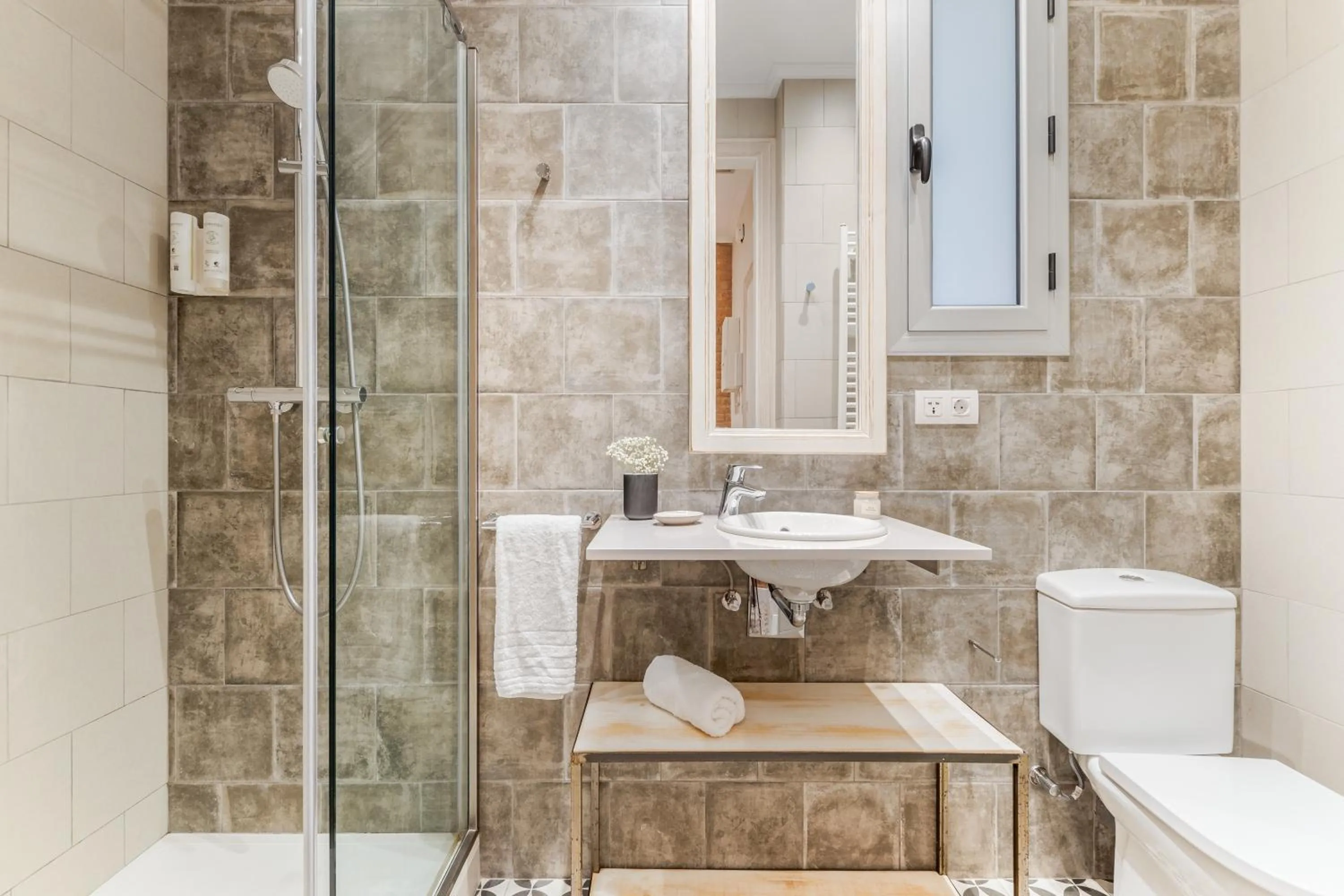 Shower in Fuster Apartments by Aspasios