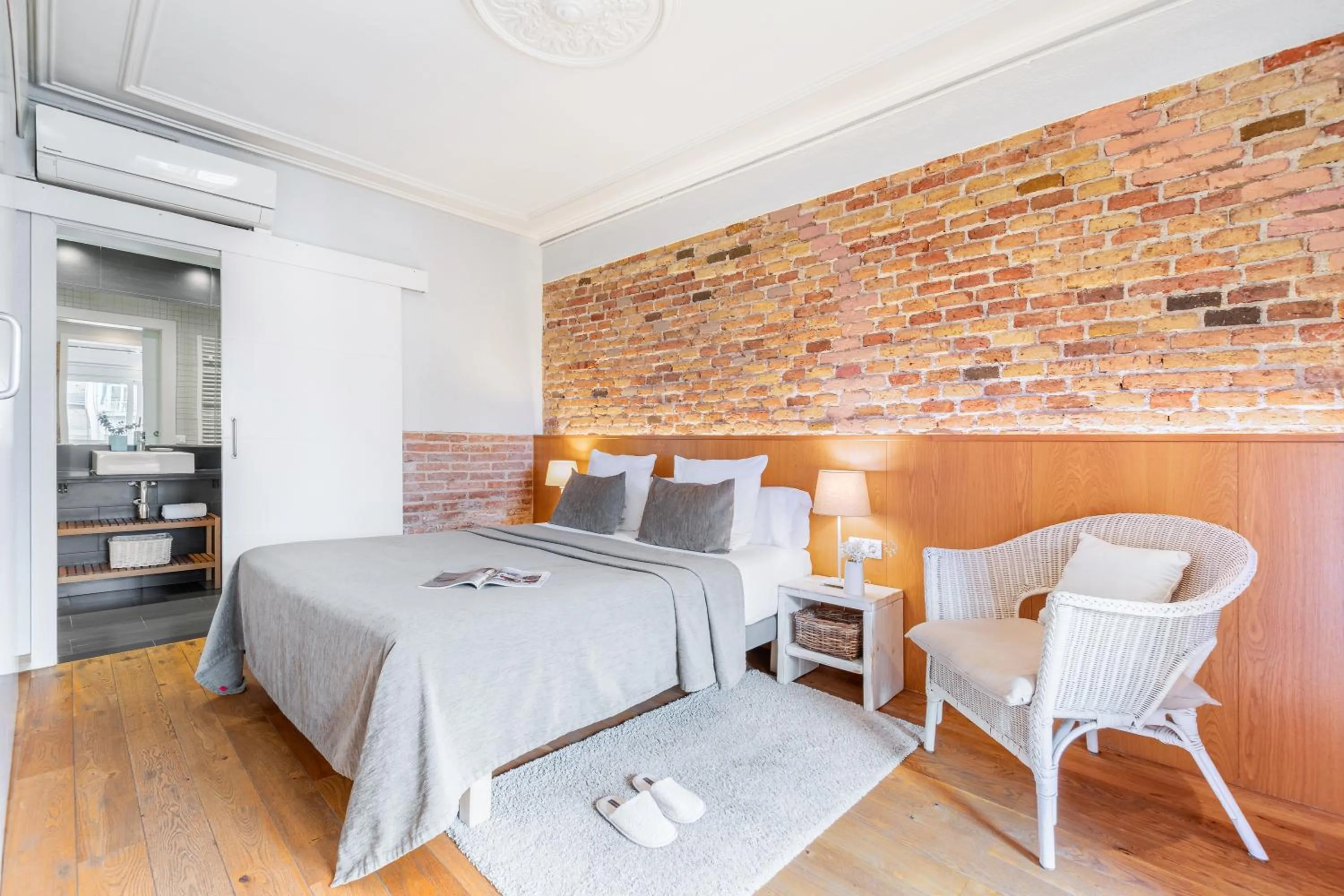 Bed in Fuster Apartments by Aspasios