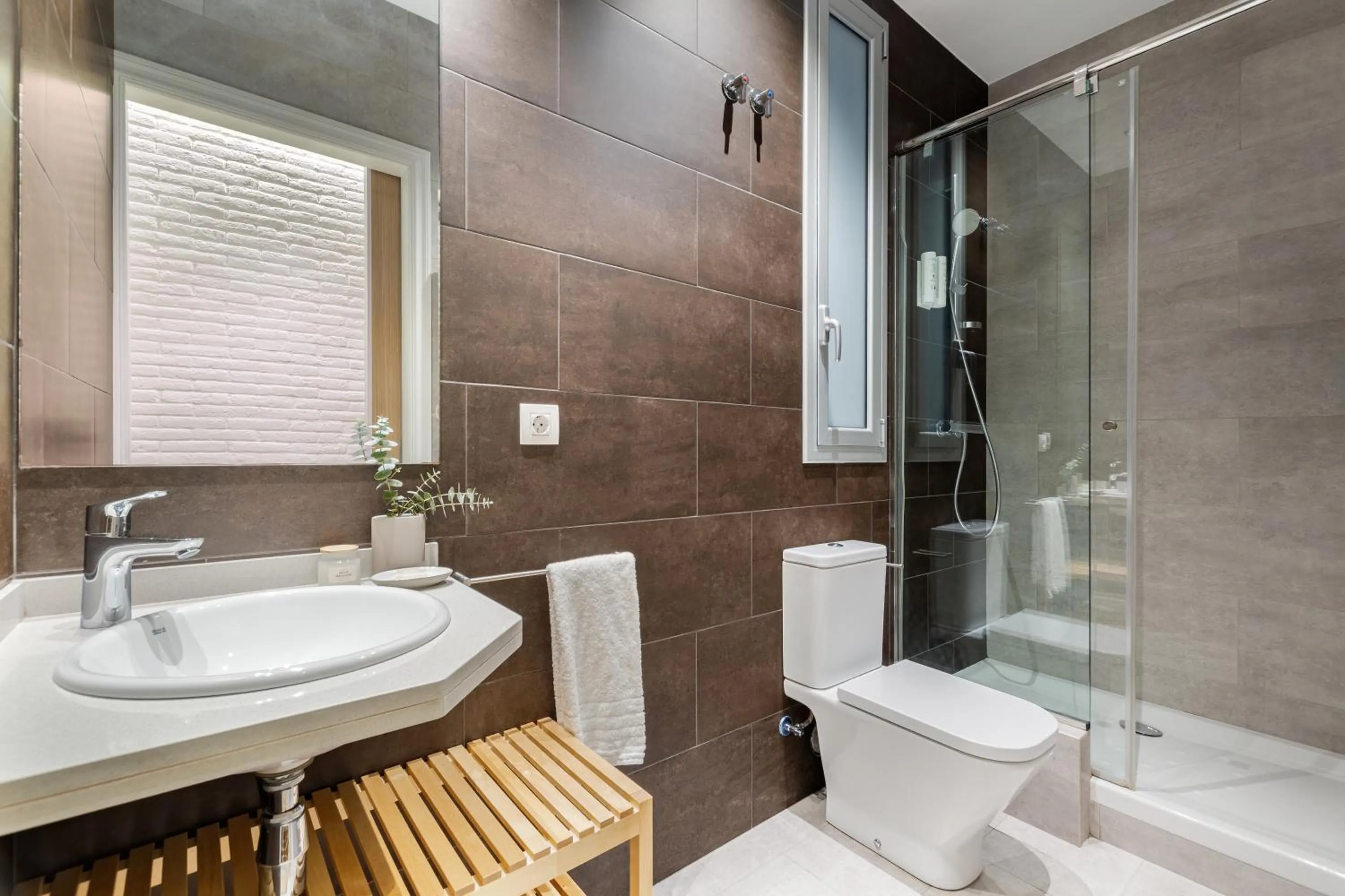 Shower in Fuster Apartments by Aspasios