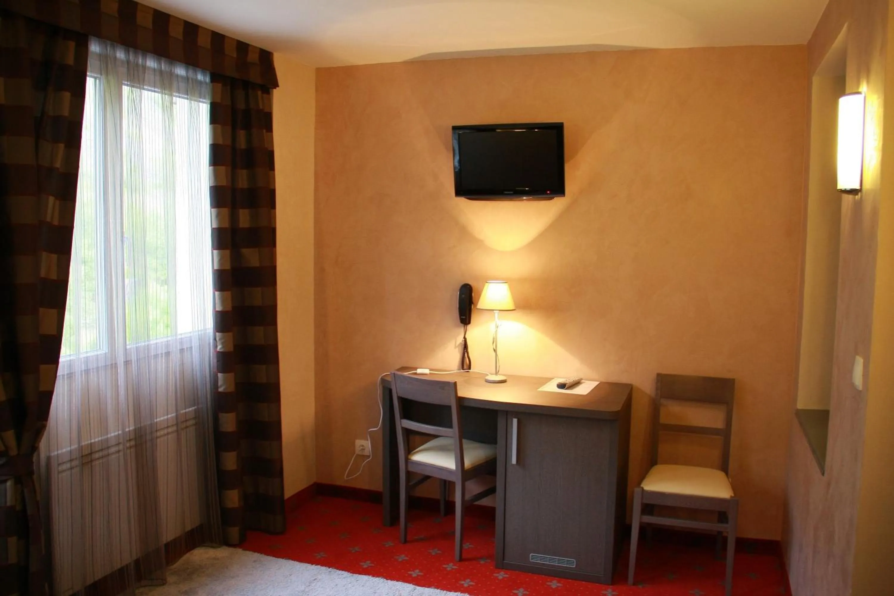 Seating area in Hôtel Le Commerce