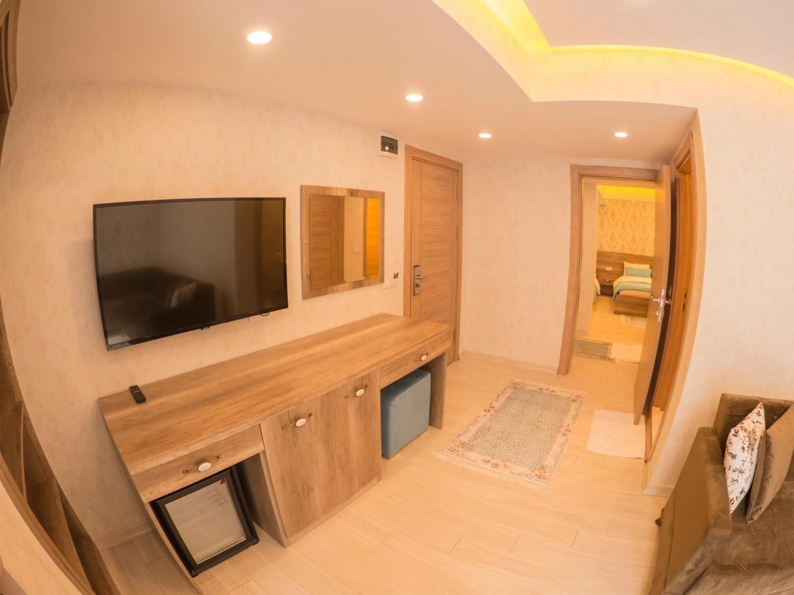 Communal lounge/ TV room, Bed in Elif Inan Hotel