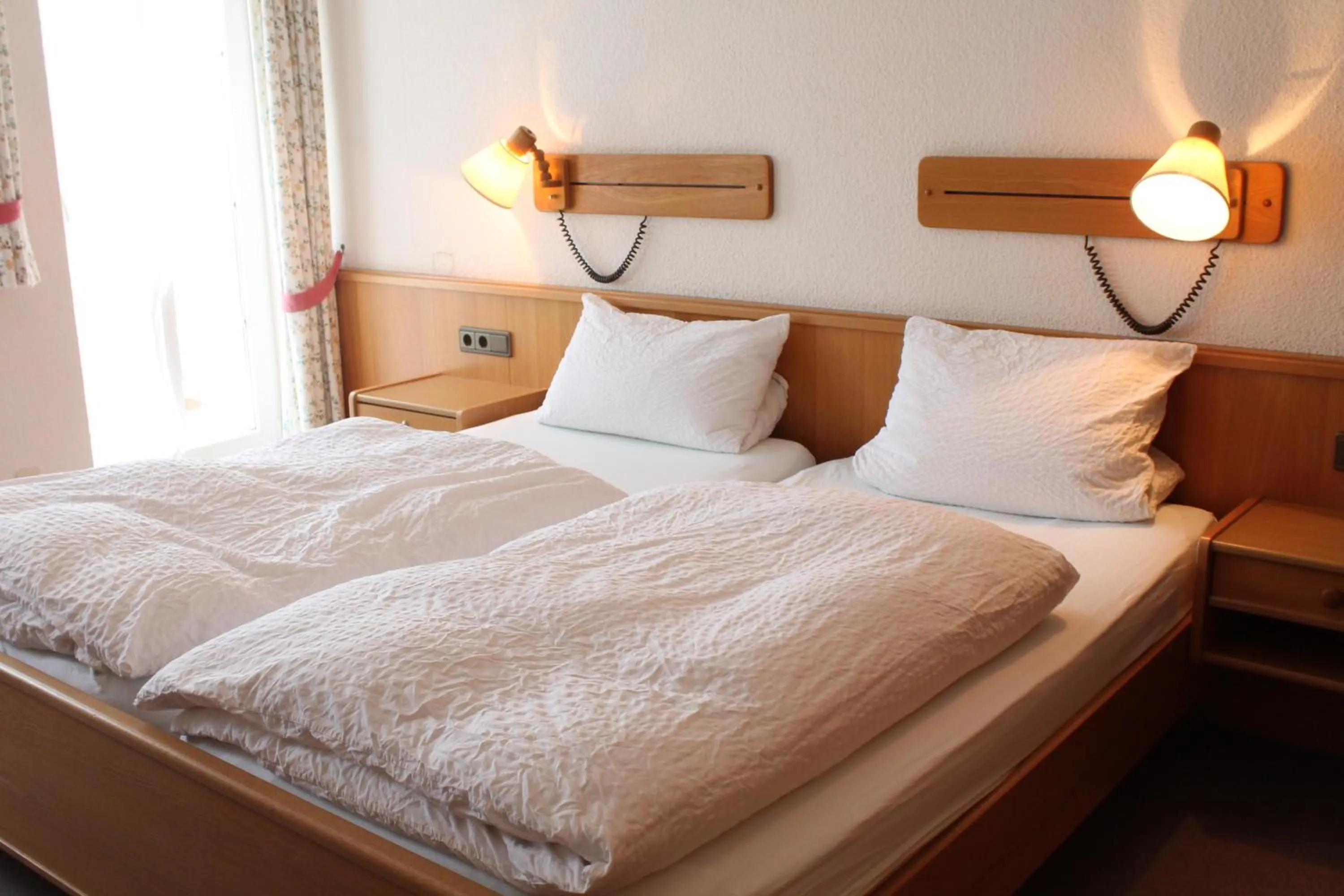 Bed in Hotel Garni Lindenmühle