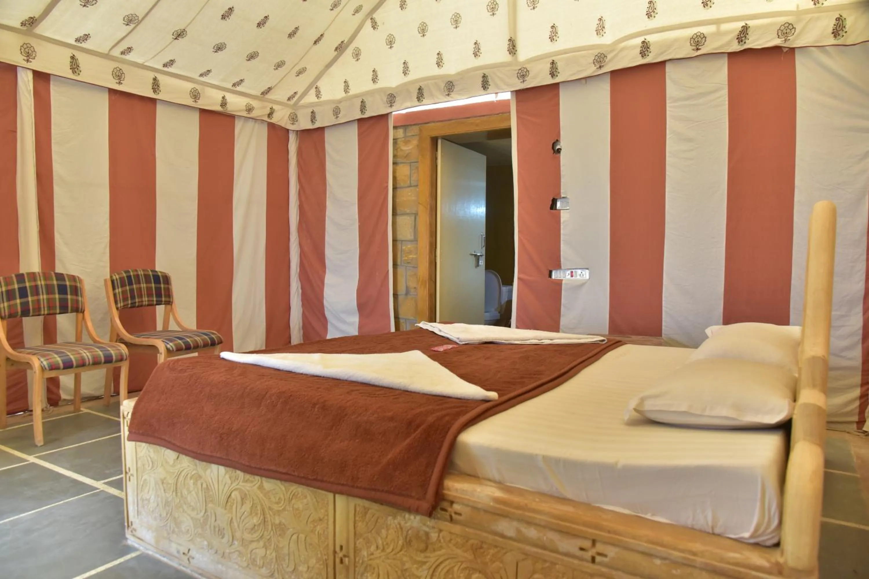 Seating area, Bed in Oasis camp sam