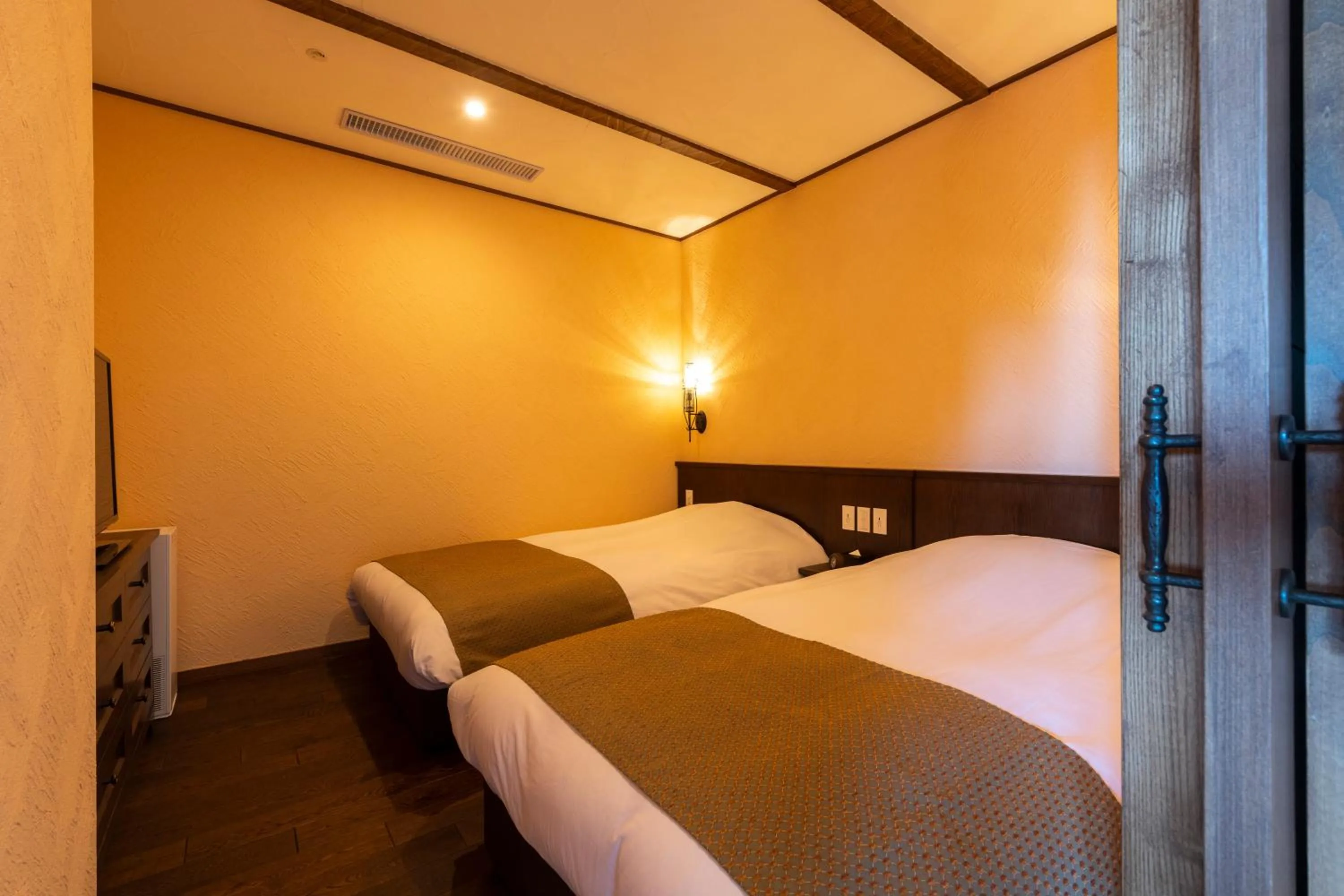 Bedroom, Bed in La Vista Kirishima Hills