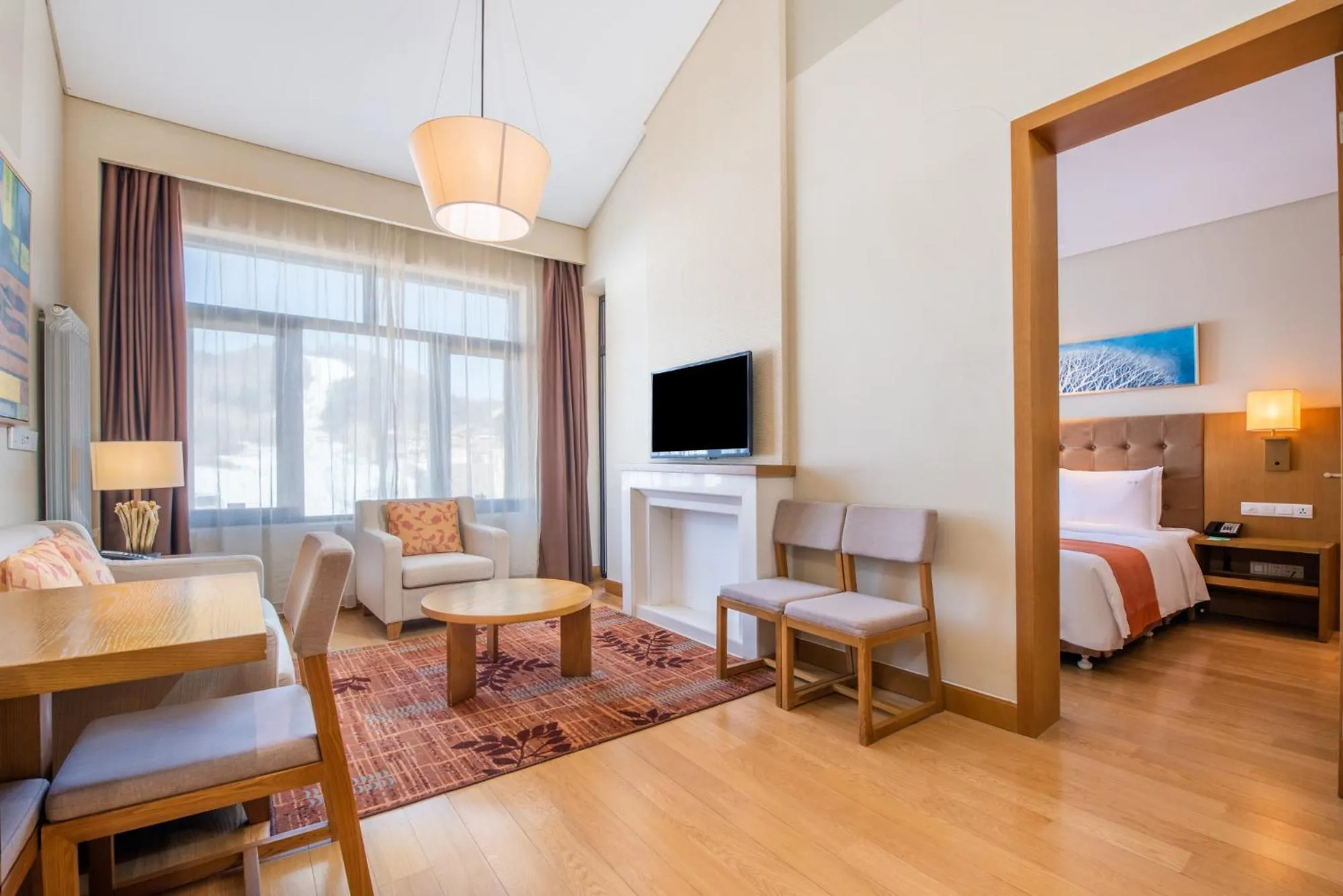 Living room, Bed in Wanda Jin Suites Changbaishan