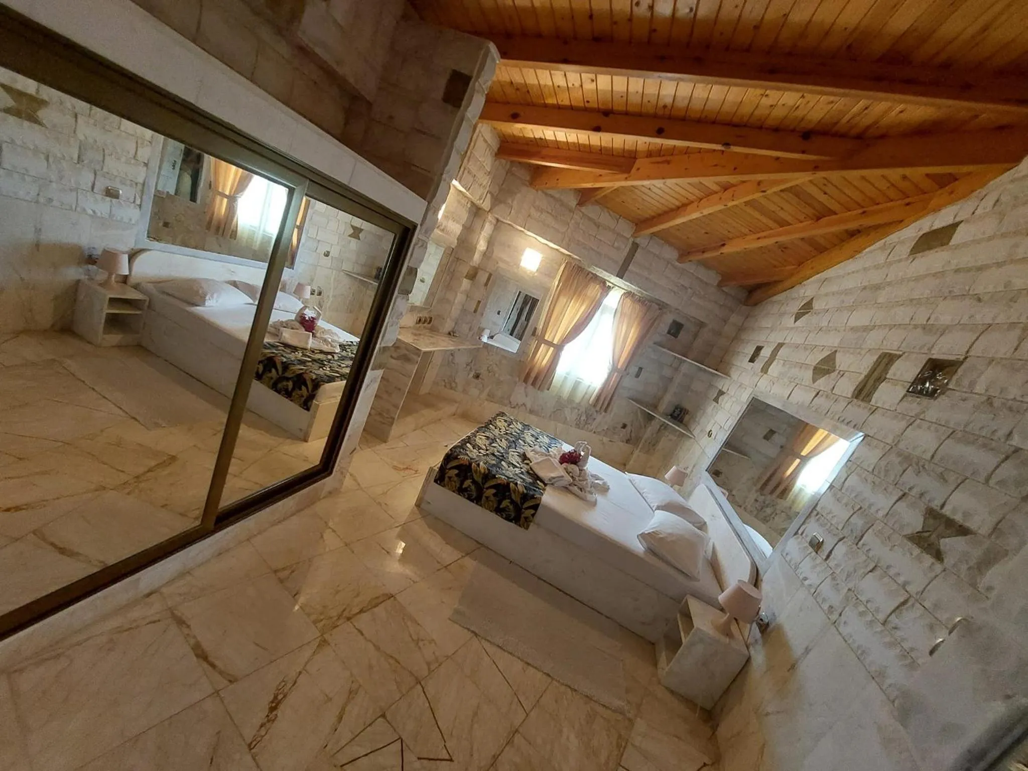 Bed in Paco's Resort Holiday Flats