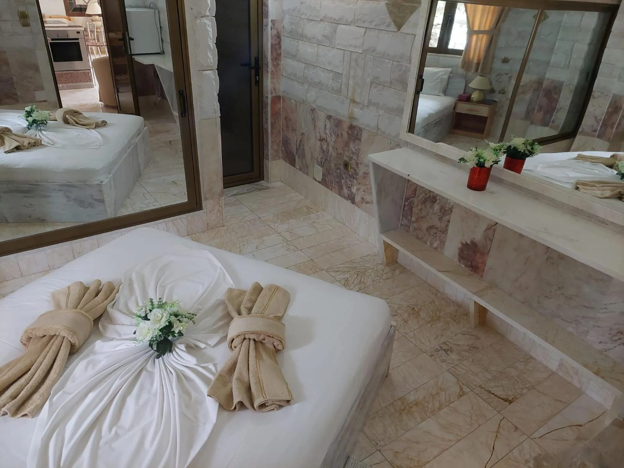 Bed in Paco's Resort Holiday Flats