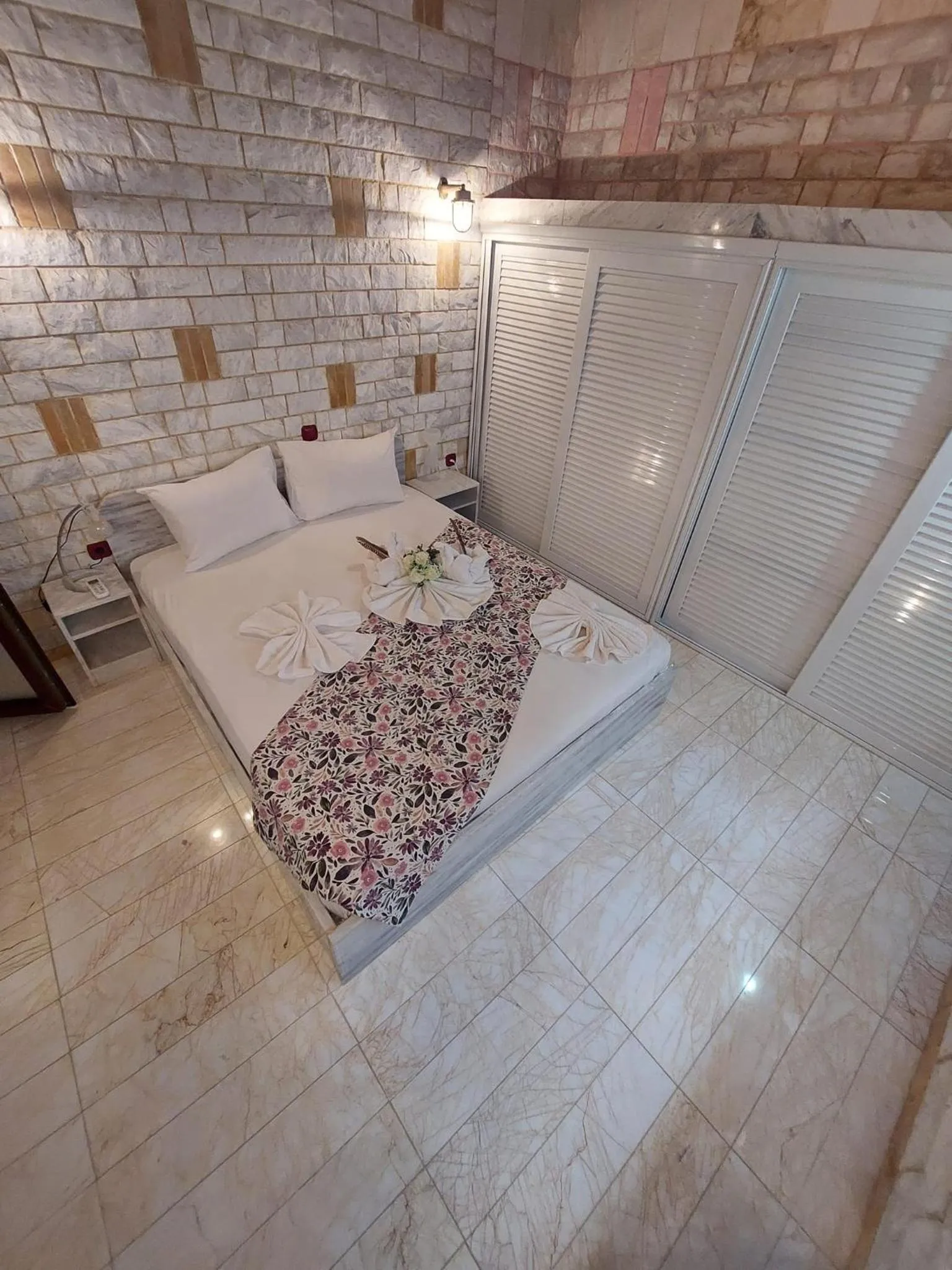 Bed in Paco's Resort Holiday Flats