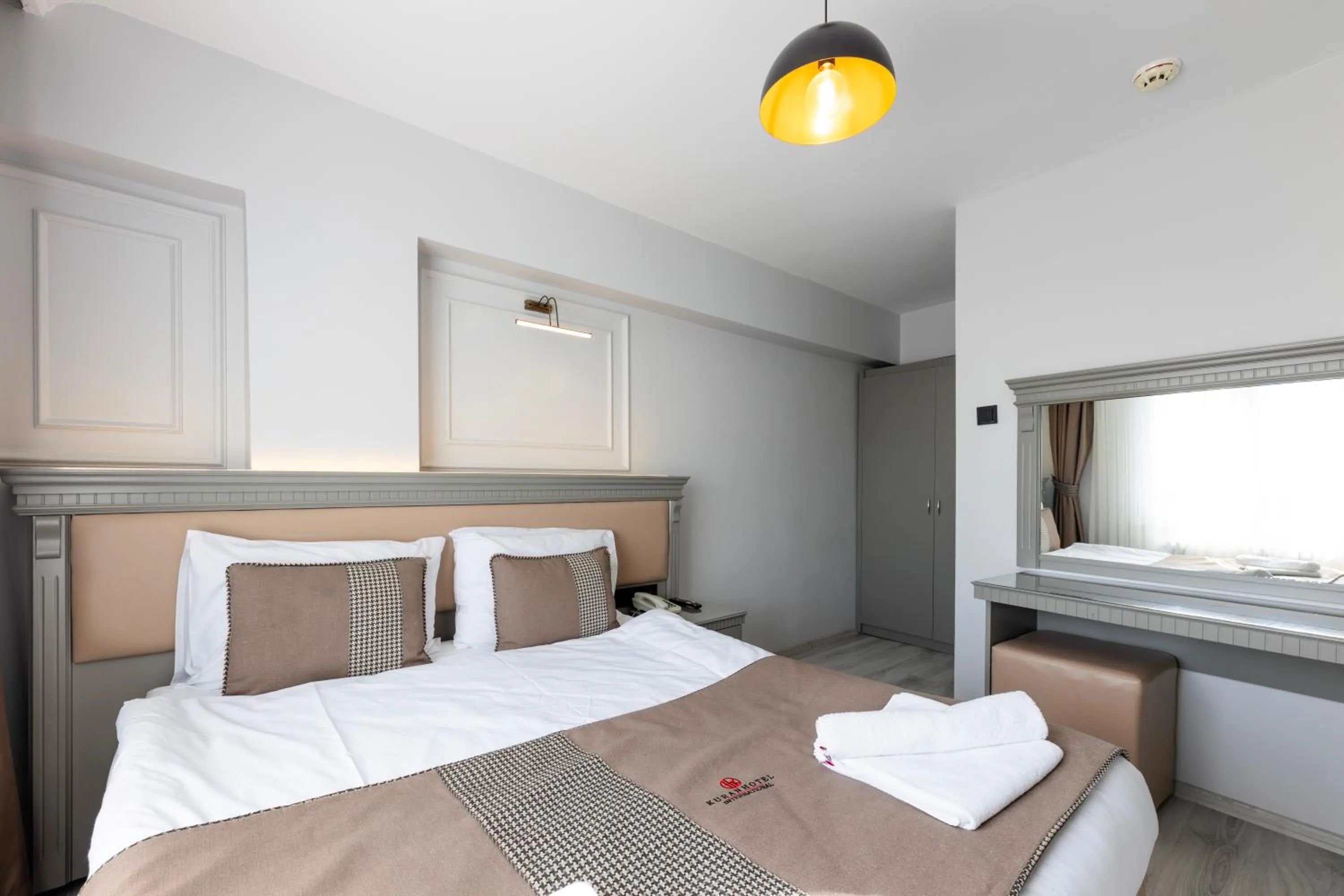 Bed in Kuran Hotel International