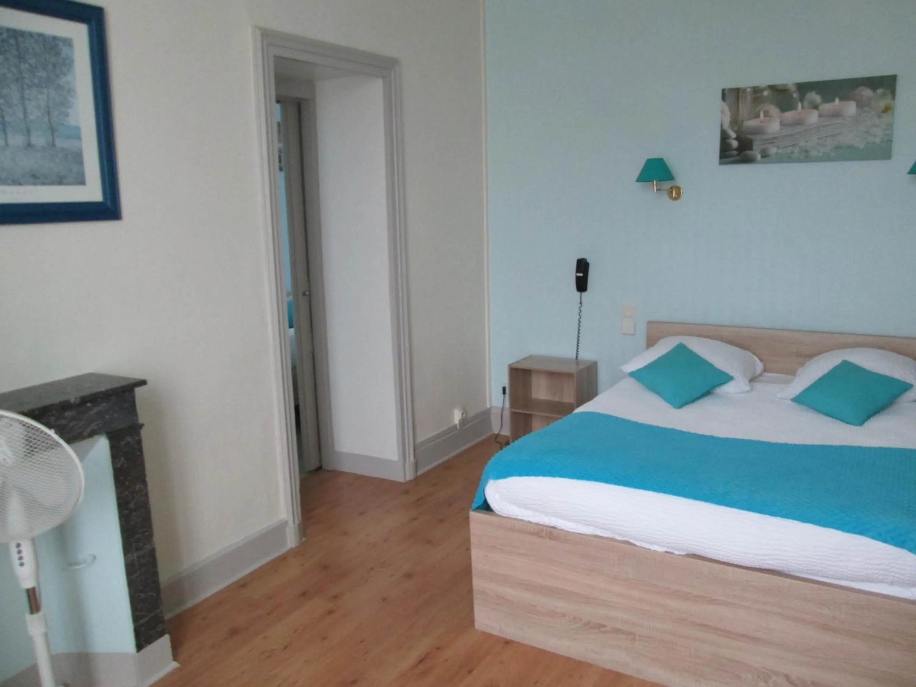 Bed in Logis Hôtel Beauséjour