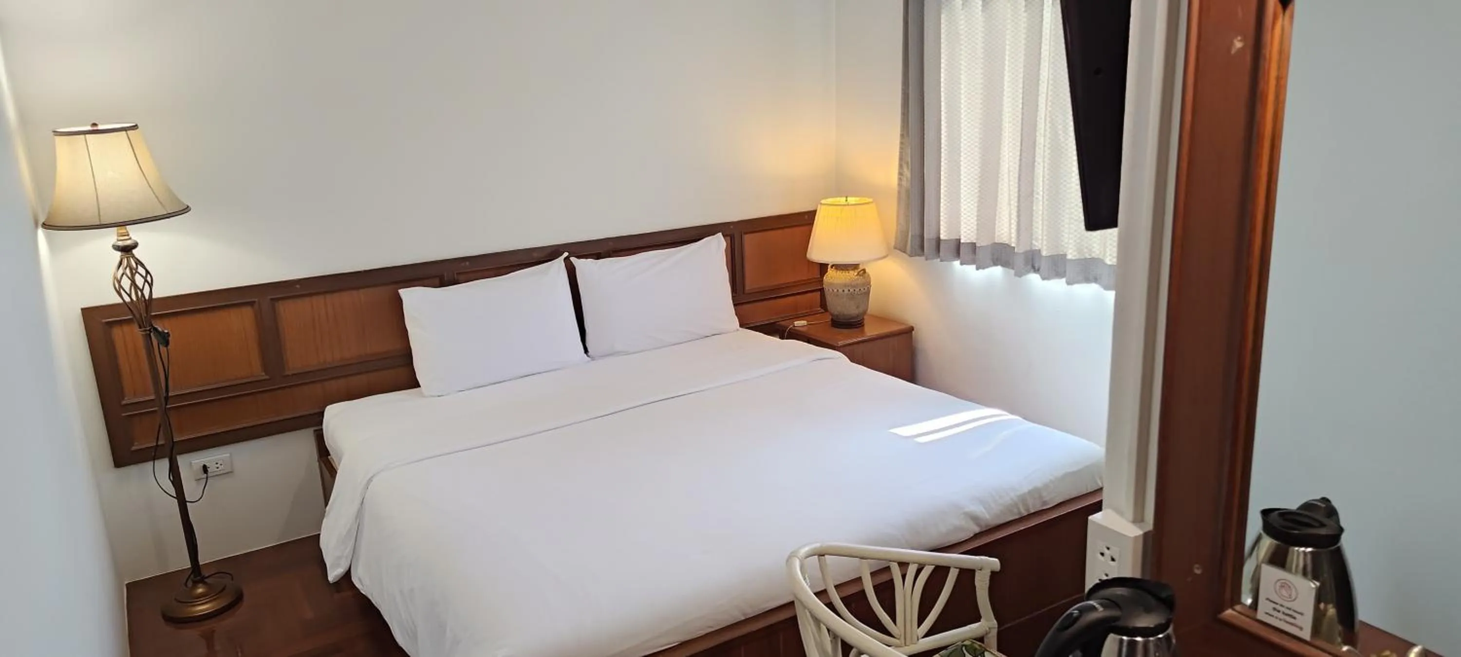 Bed in Puangpen Villa Hotel