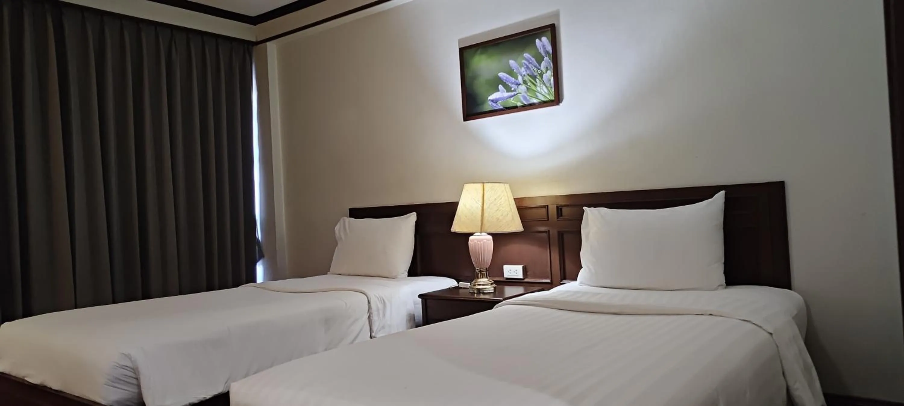 Bed in Puangpen Villa Hotel