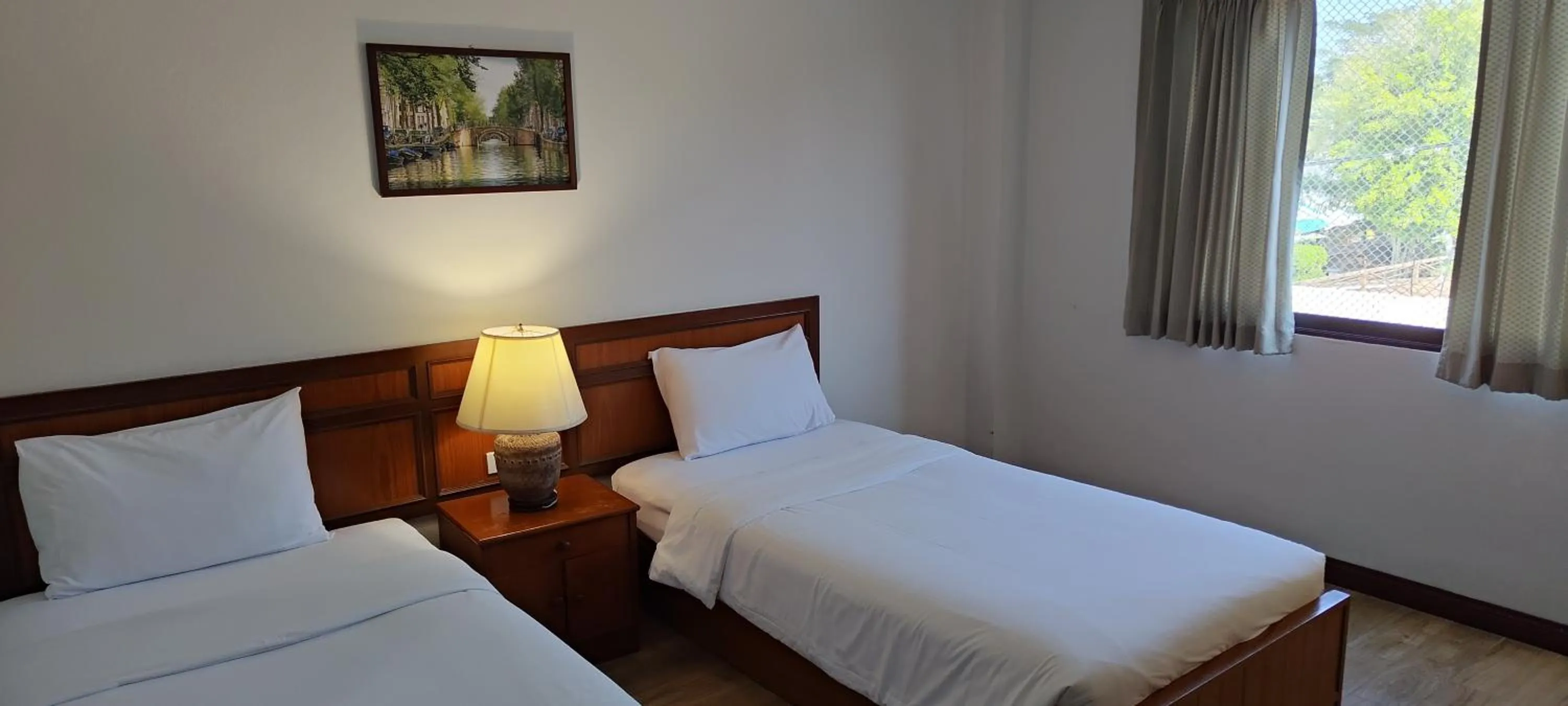 Bed in Puangpen Villa Hotel